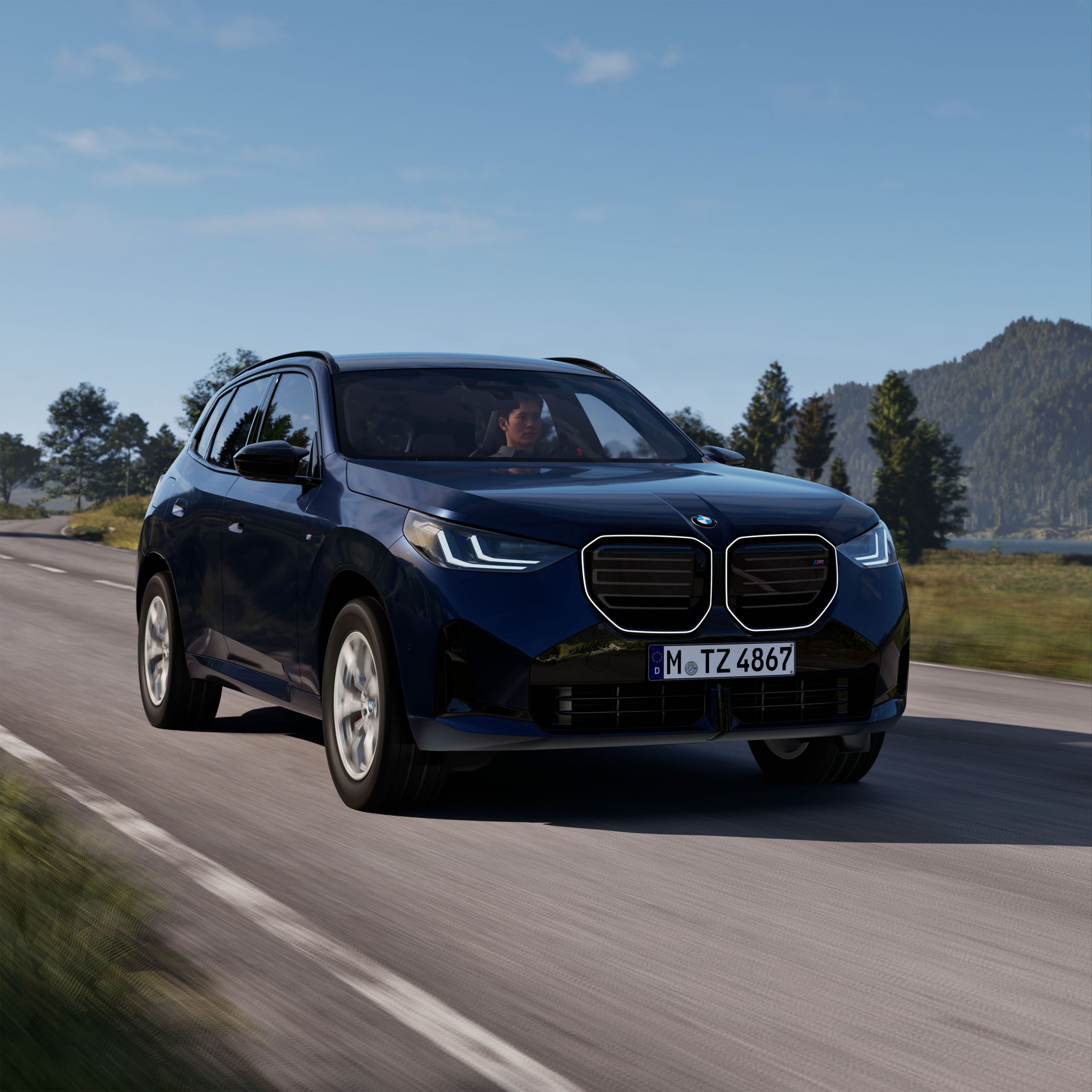 BMW X3 30e xDrive sedd snett framifrån körandes på en landsväg