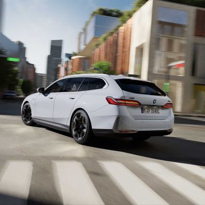 BMW 5 Series Touring white rear view 