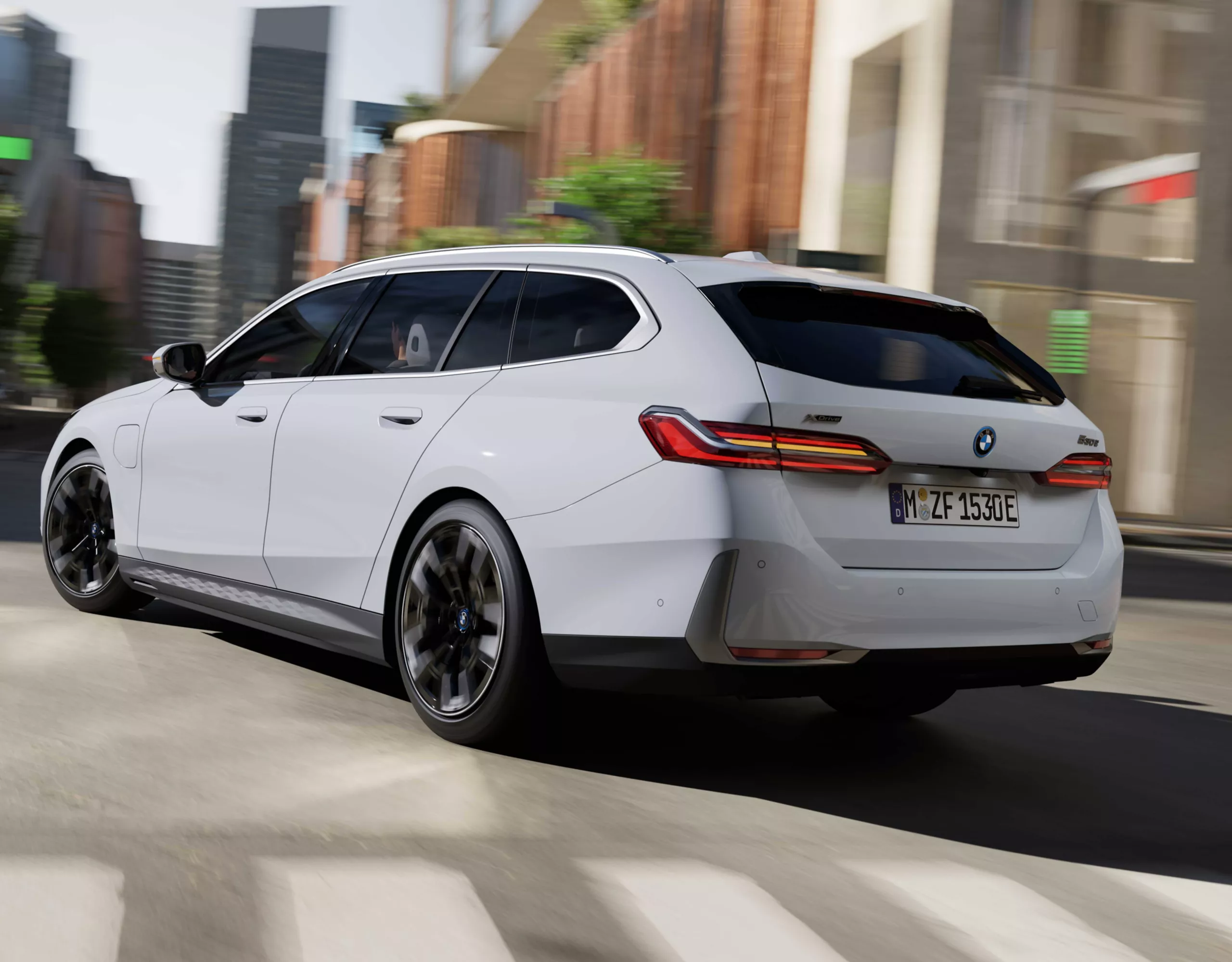 BMW 5 Series Touring white rear view 