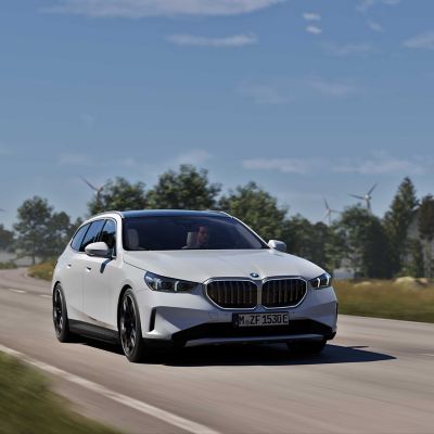 BMW 5 Series Touring white front view 