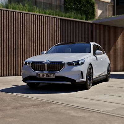 BMW 5 Series Touring Plug-in Hybrid white front view