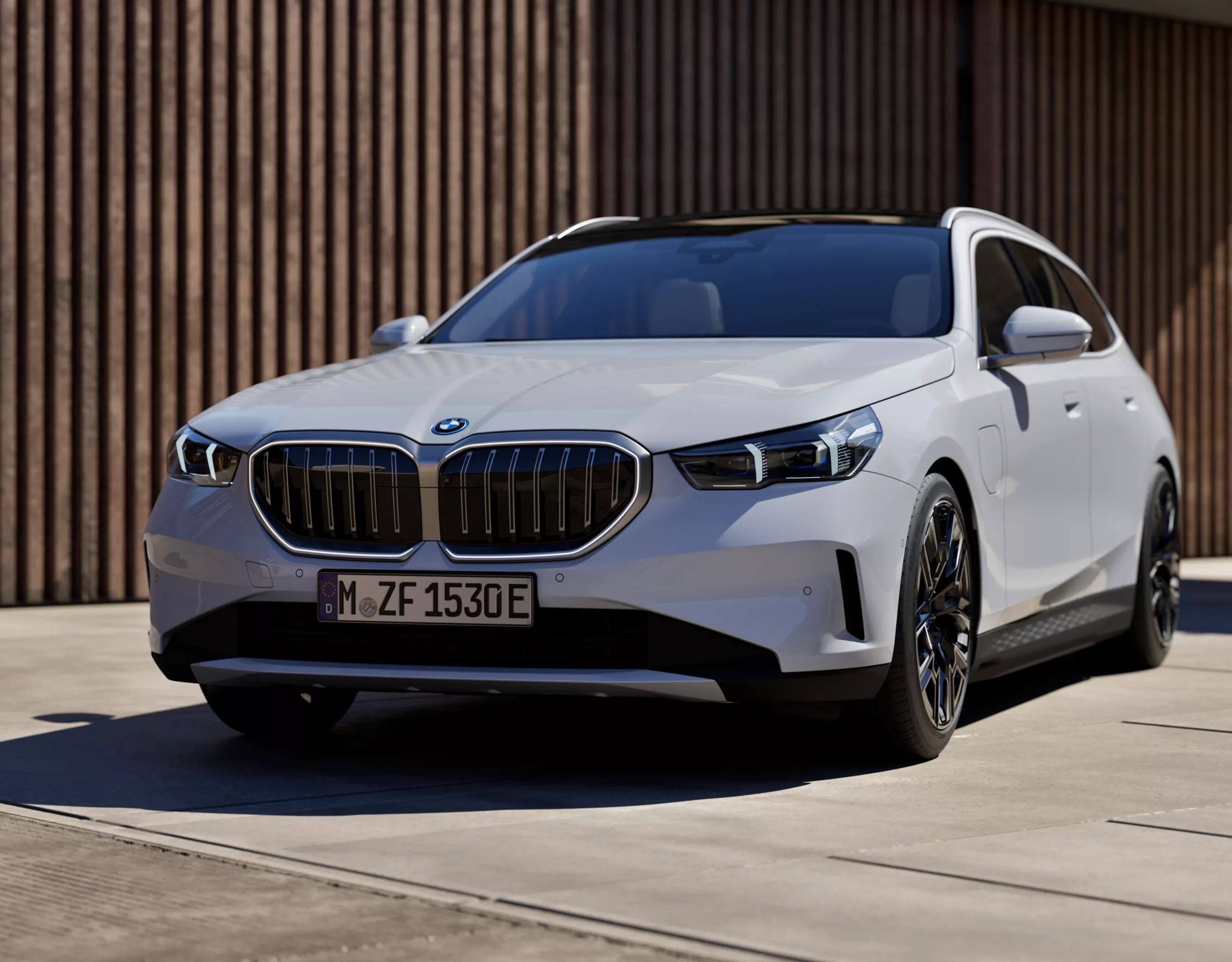 BMW 5 Series Touring Plug-in Hybrid white front view