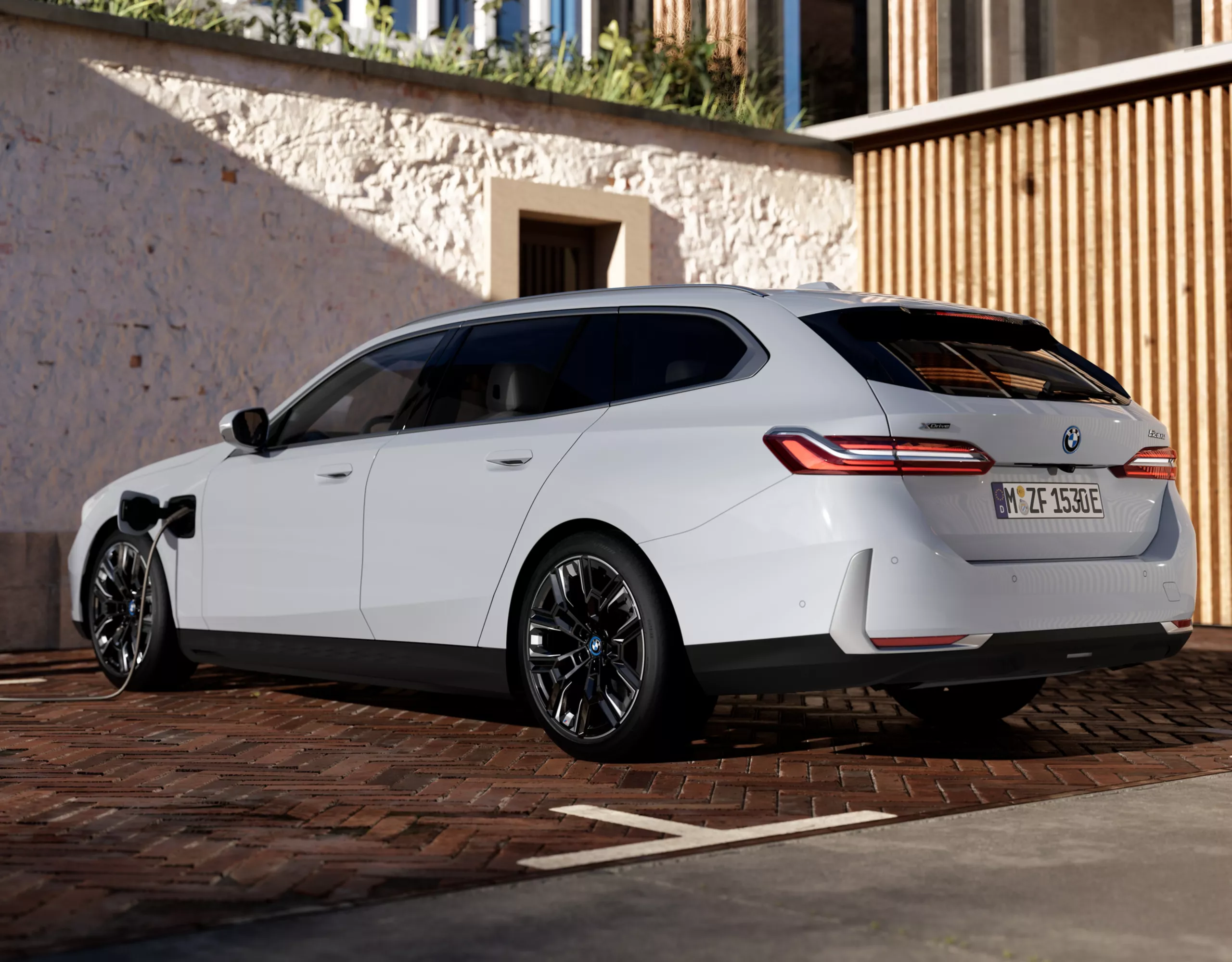 BMW 5 Series Touring Plug-in Hybrid white rear view