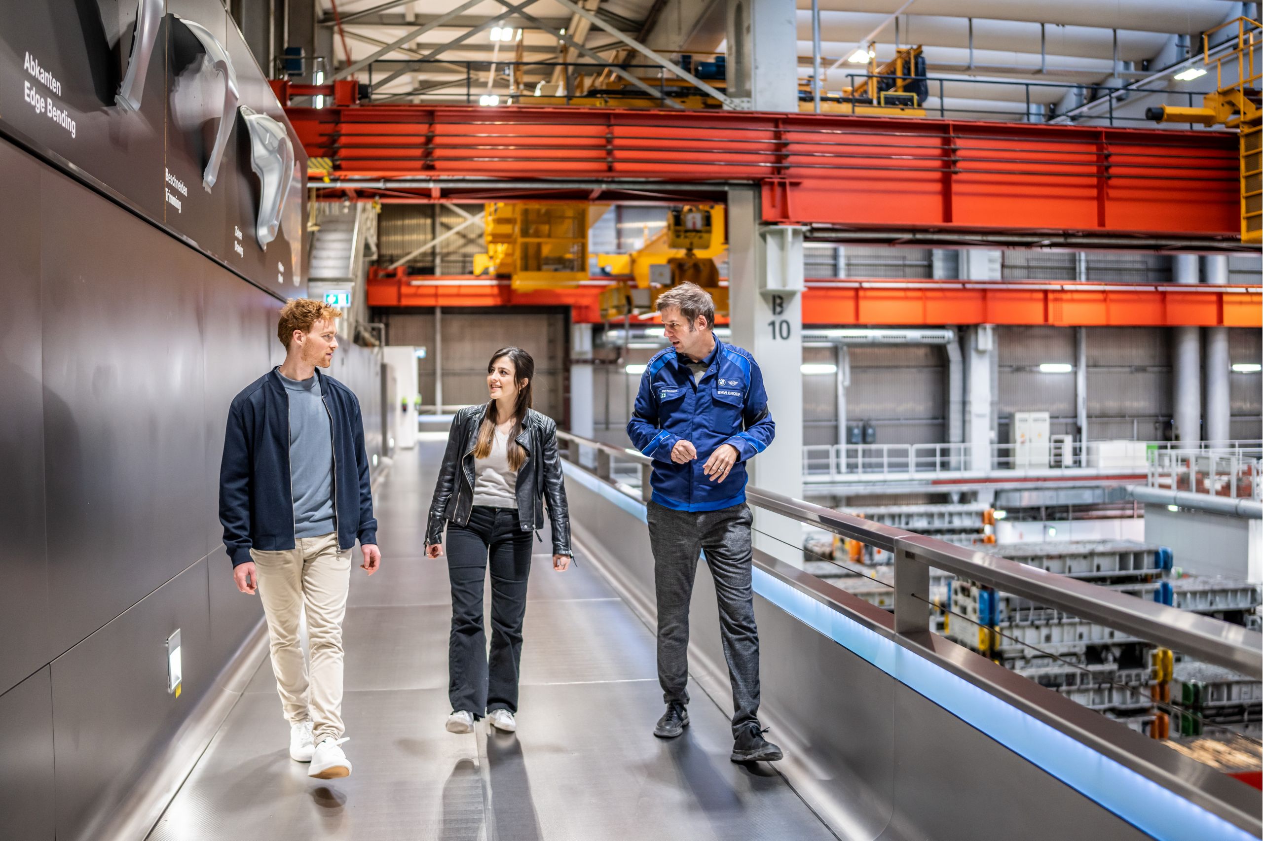 Couple is guided through the BMW Group plant facility