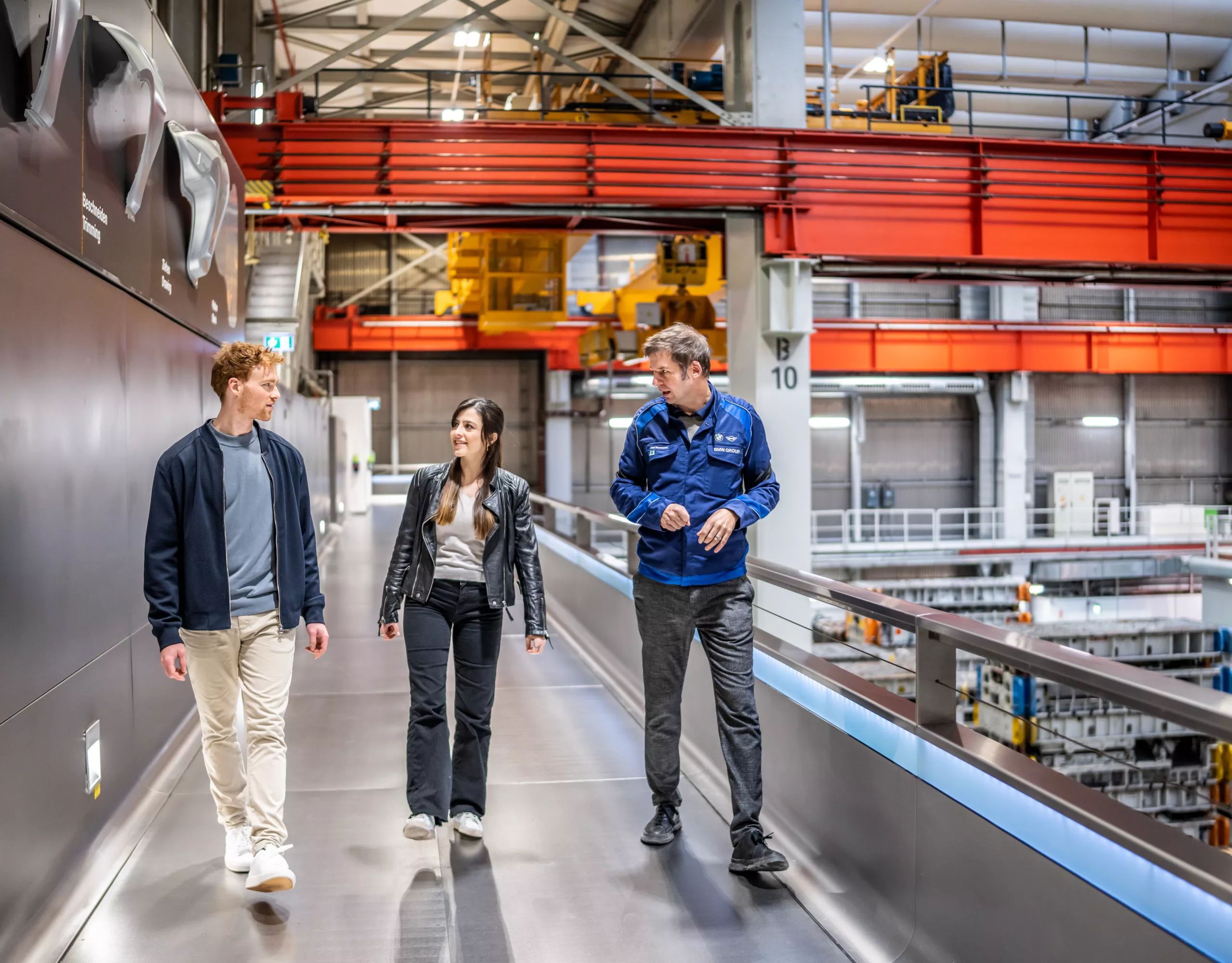 Couple is guided through the BMW Group plant facility.
