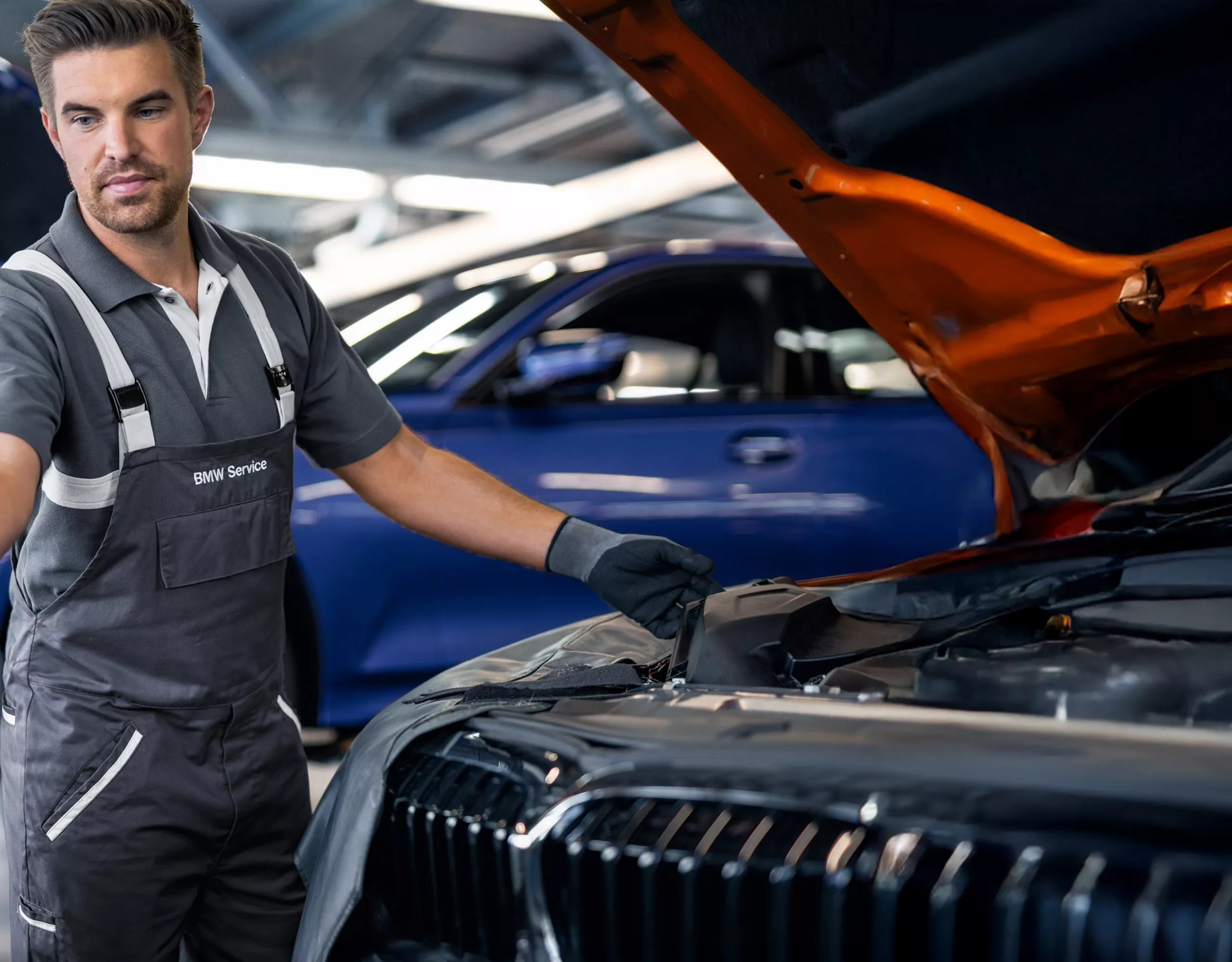 Mechanic working on car in garage