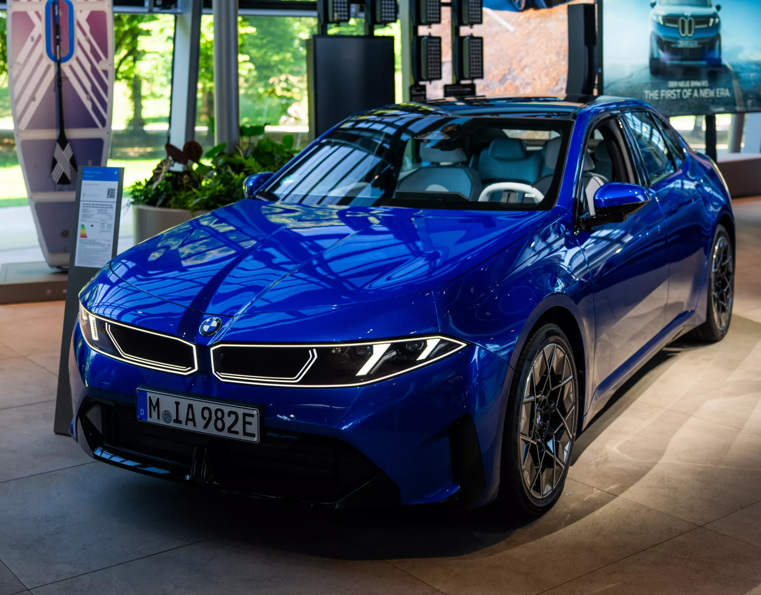 Side view of a blue BMW i3 at BMW Welt.