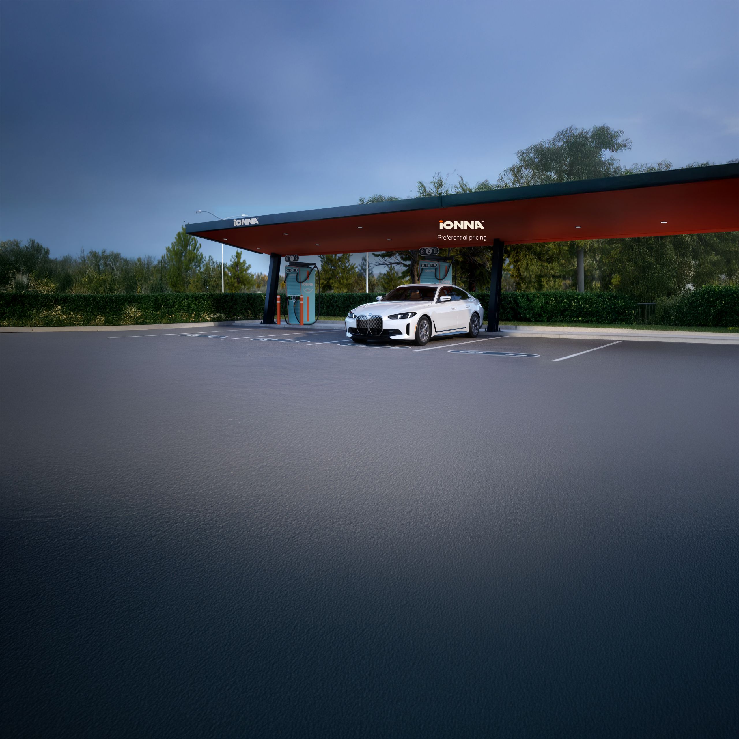 BMW i4 Gran Coupe parked at an IONNA charging station.