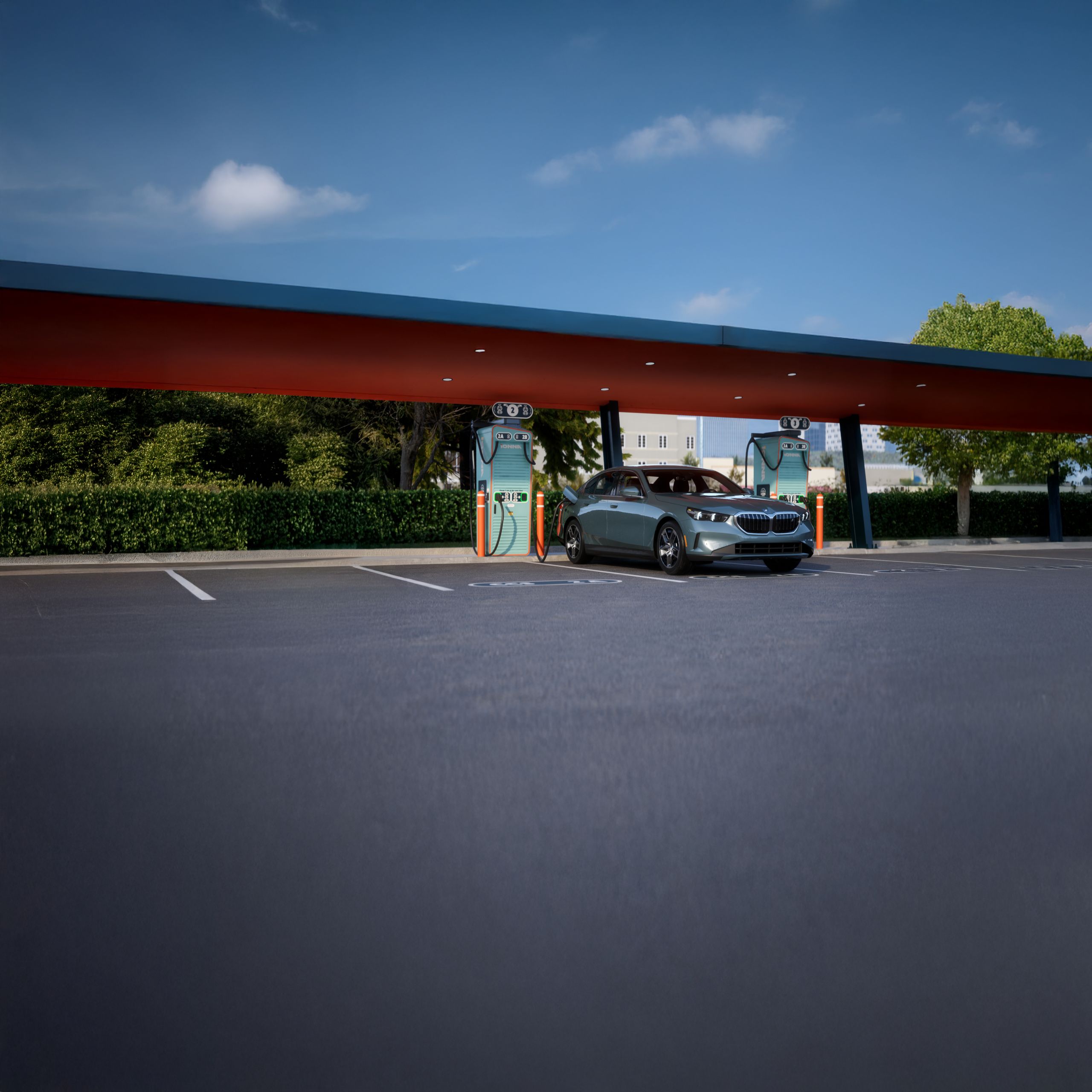 A BMW Certified i5 charges at an IONNA charging station.