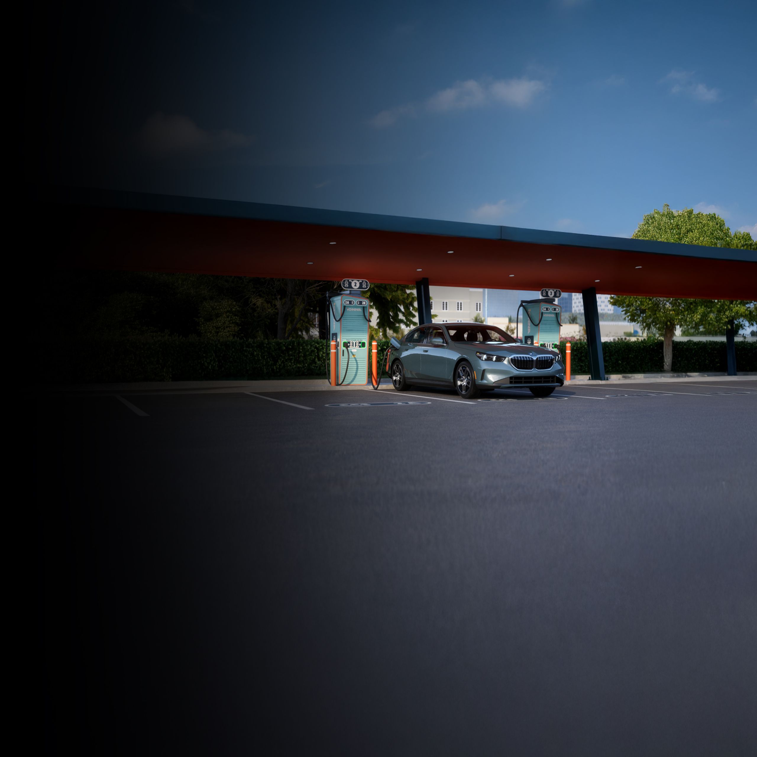 The BMW i5 Sedan parked at an IONNA charging station.