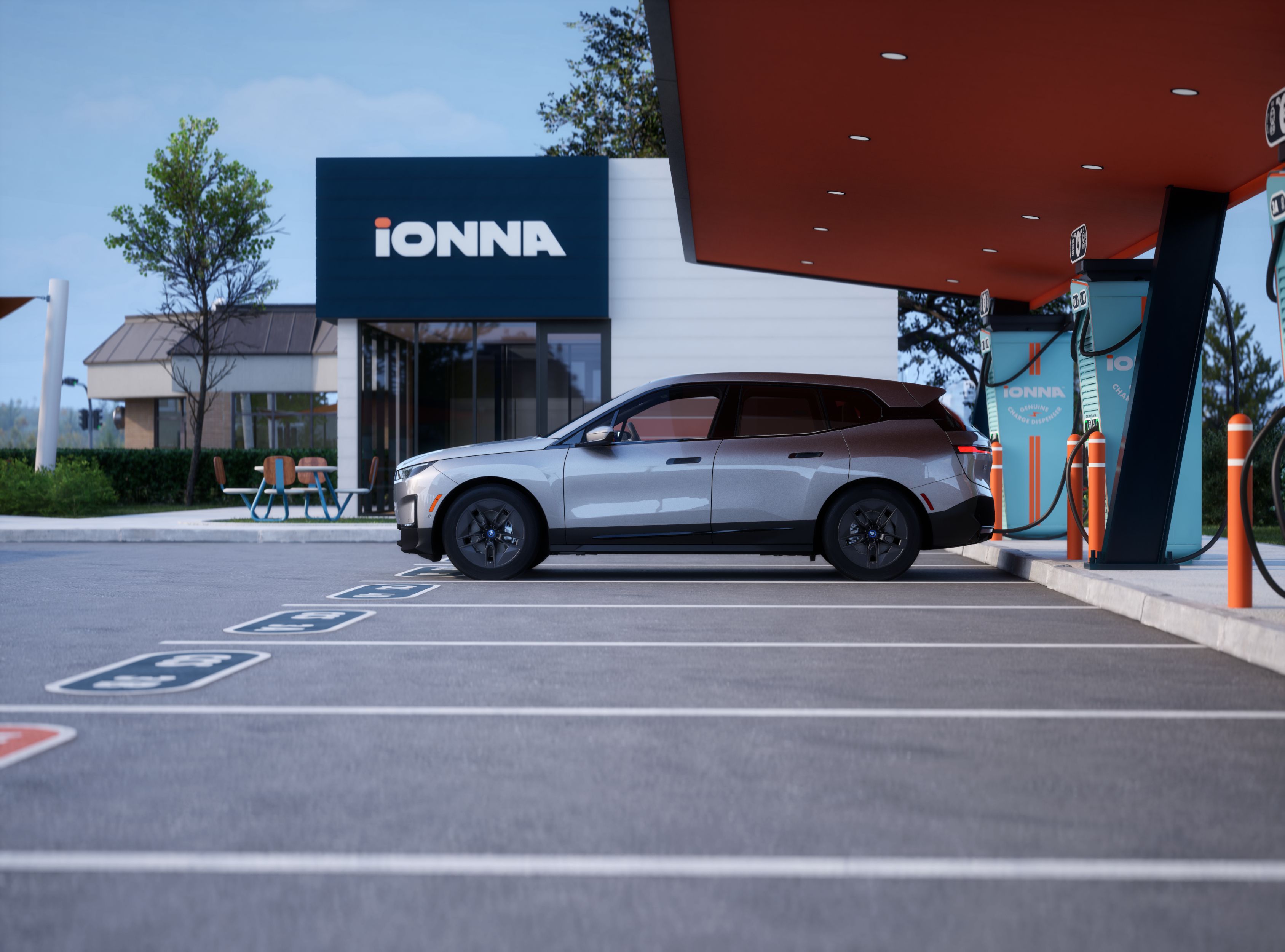 Side shot of a BMW Certified iX charging at an IONNA charging station