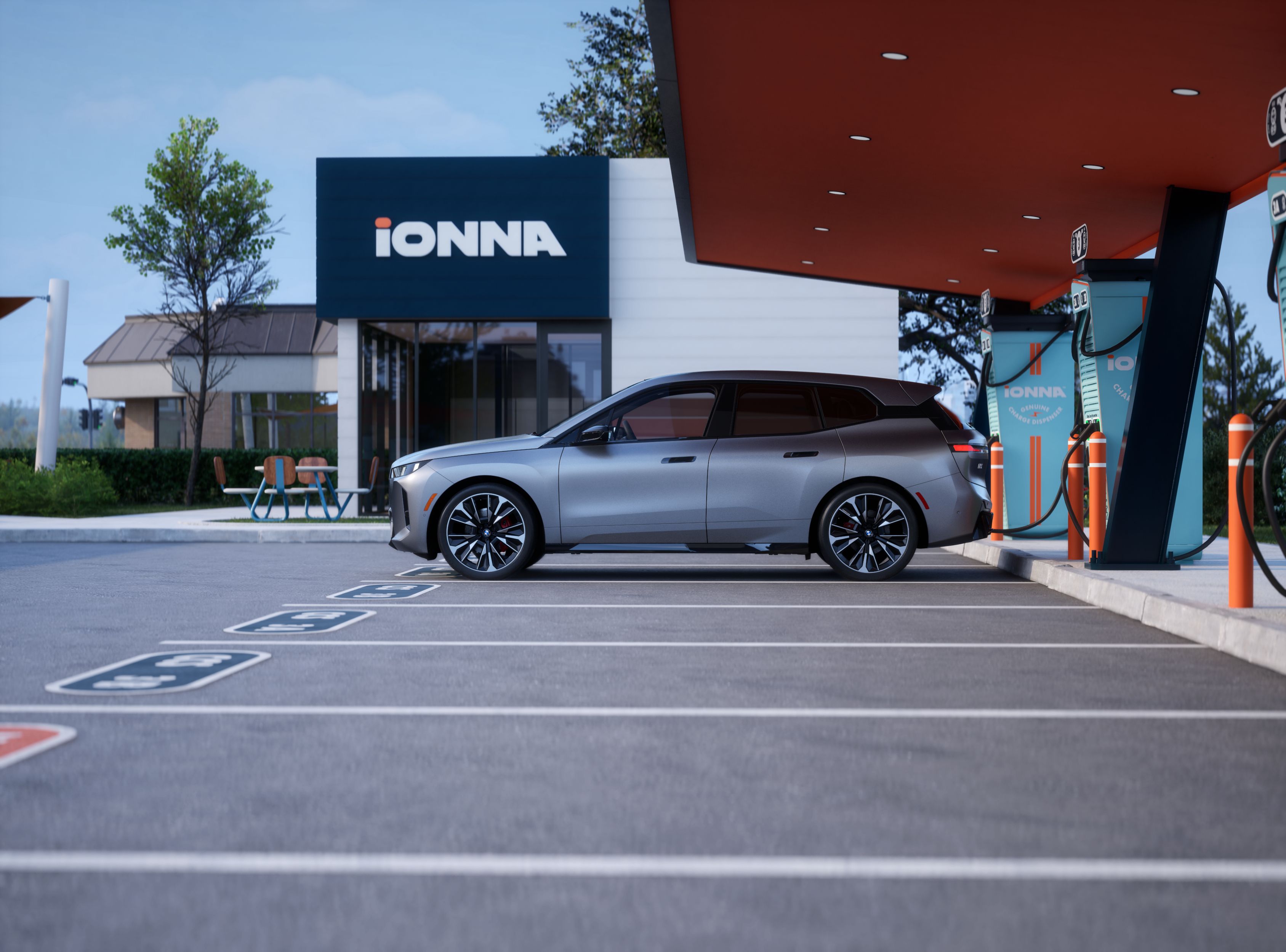 Side shot of a BMW Certified iX charging at an IONNA charging station
