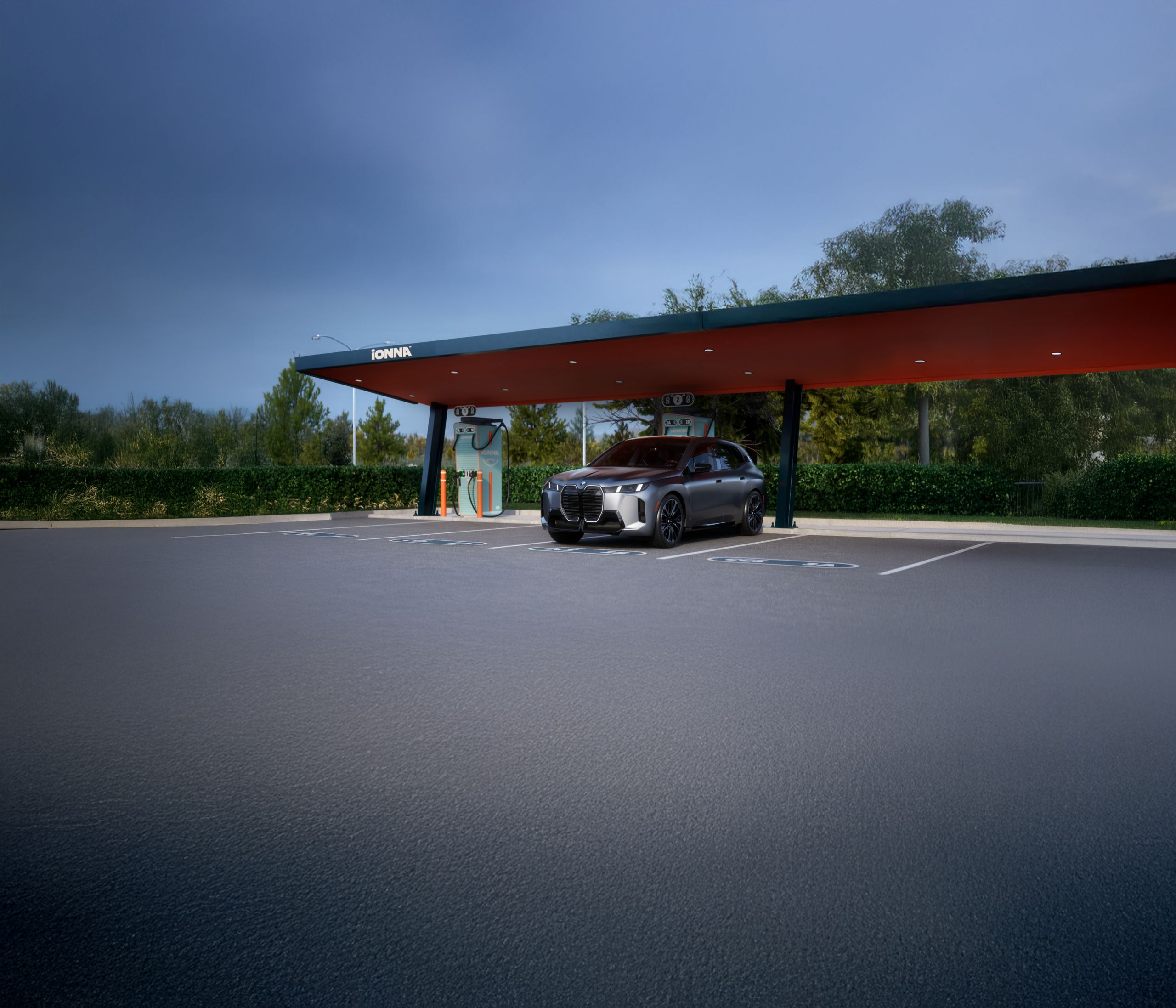 The BMW iX M70 SUV parked at an IONNA charging station.