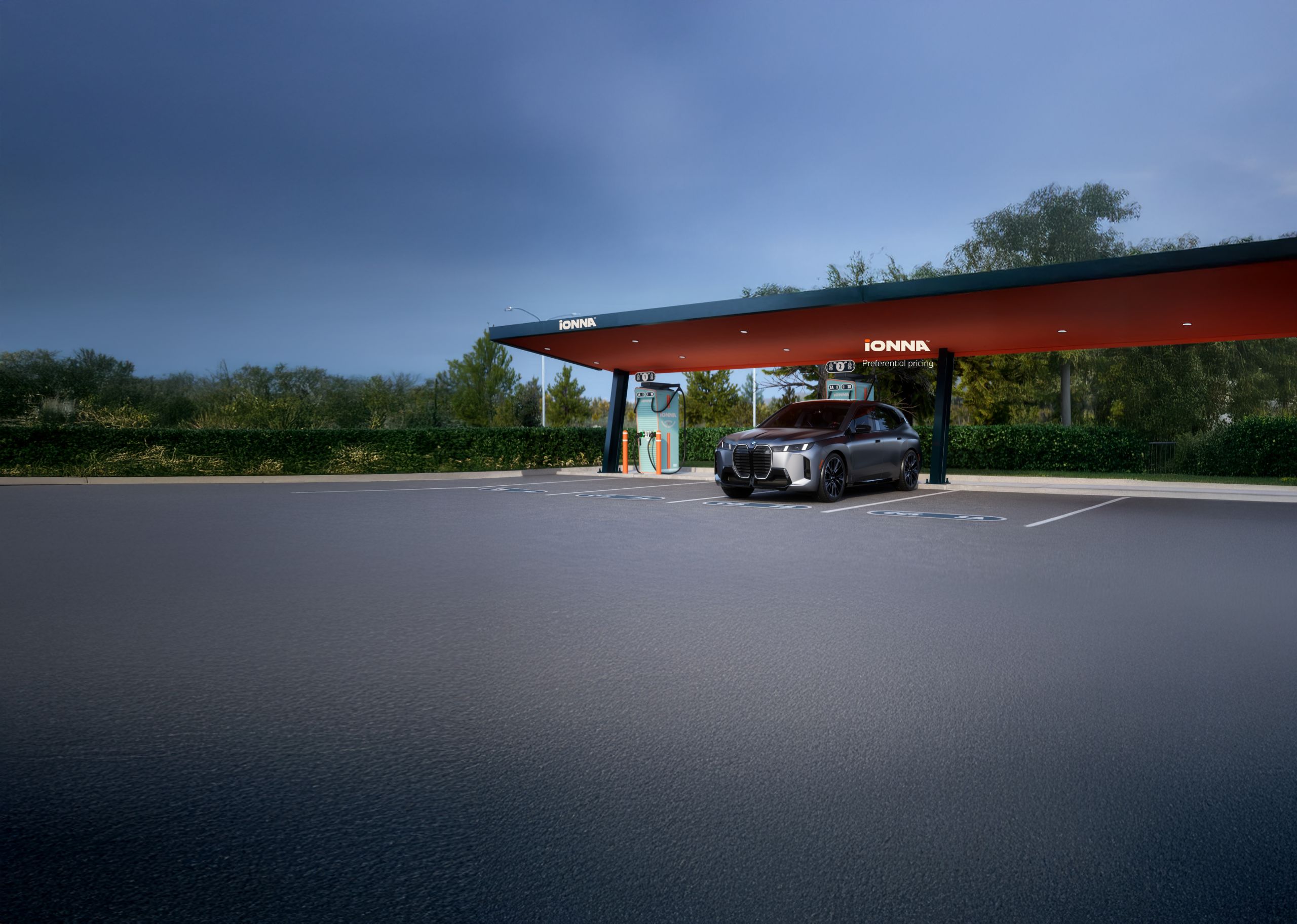 A BMW Certified iX charges at an IONNA charging station.
