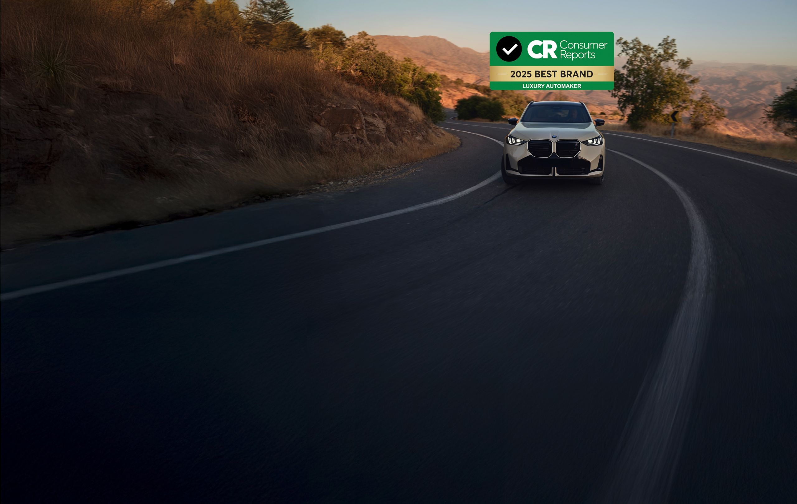 Consumer Reports 2025 Best Brand graphic imposed over an image of a BMW driving on a windy road