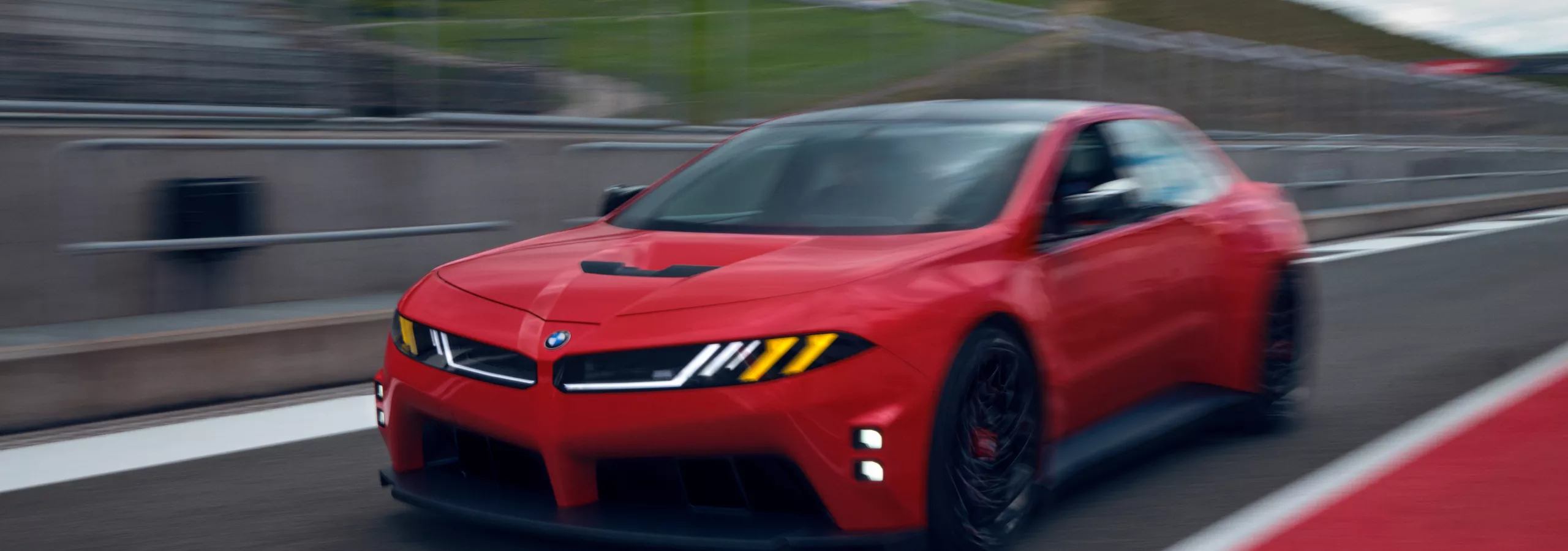 A BMW M Concept Neue Klasse model driving down a racetrack