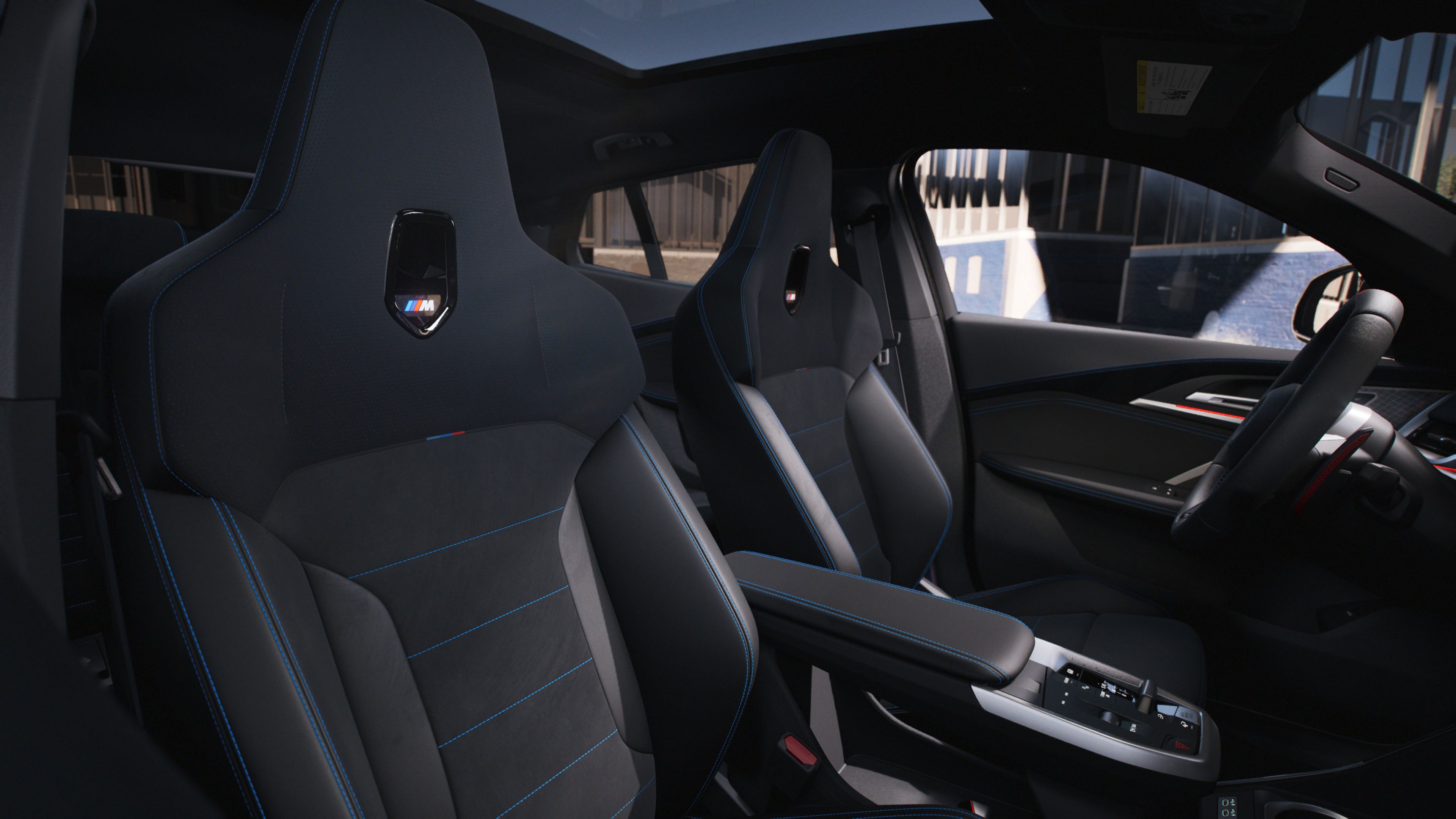 View of the M35i's interior focusing on the center console and sport seats