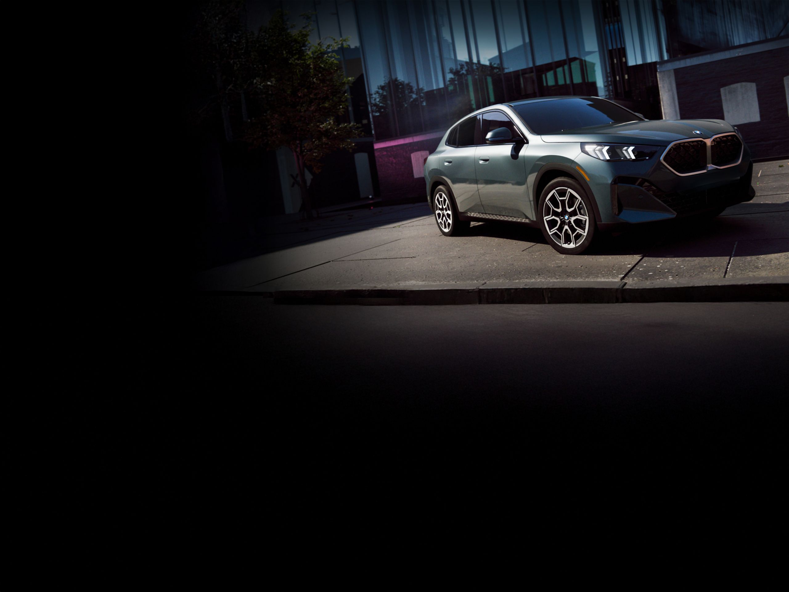 The BMW X2 Coupe SUV parked in an urban landscape