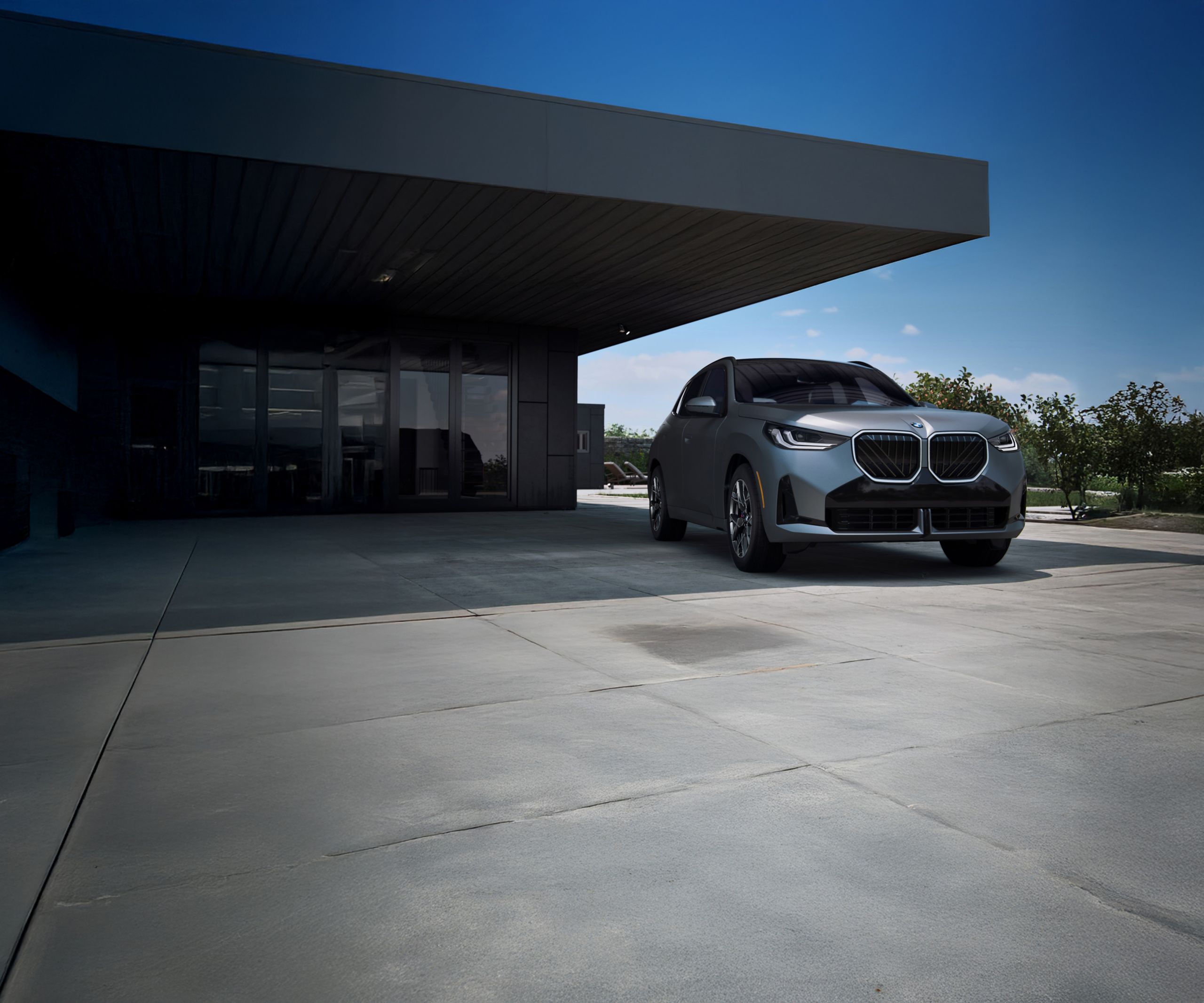 A BMW X3 30 xDrive SUV parked near a scenic overlook near the ocean