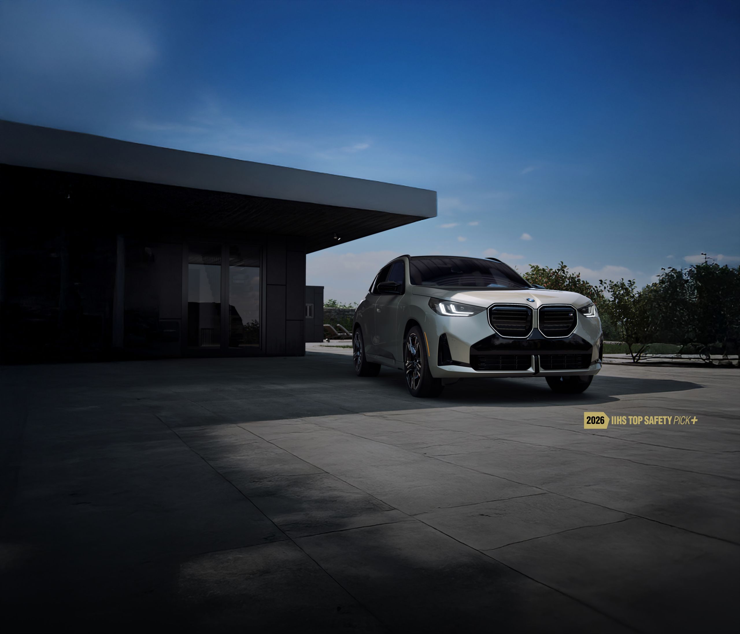 A BMW X3 SUV parked in the shade of an overhang on a sunny day