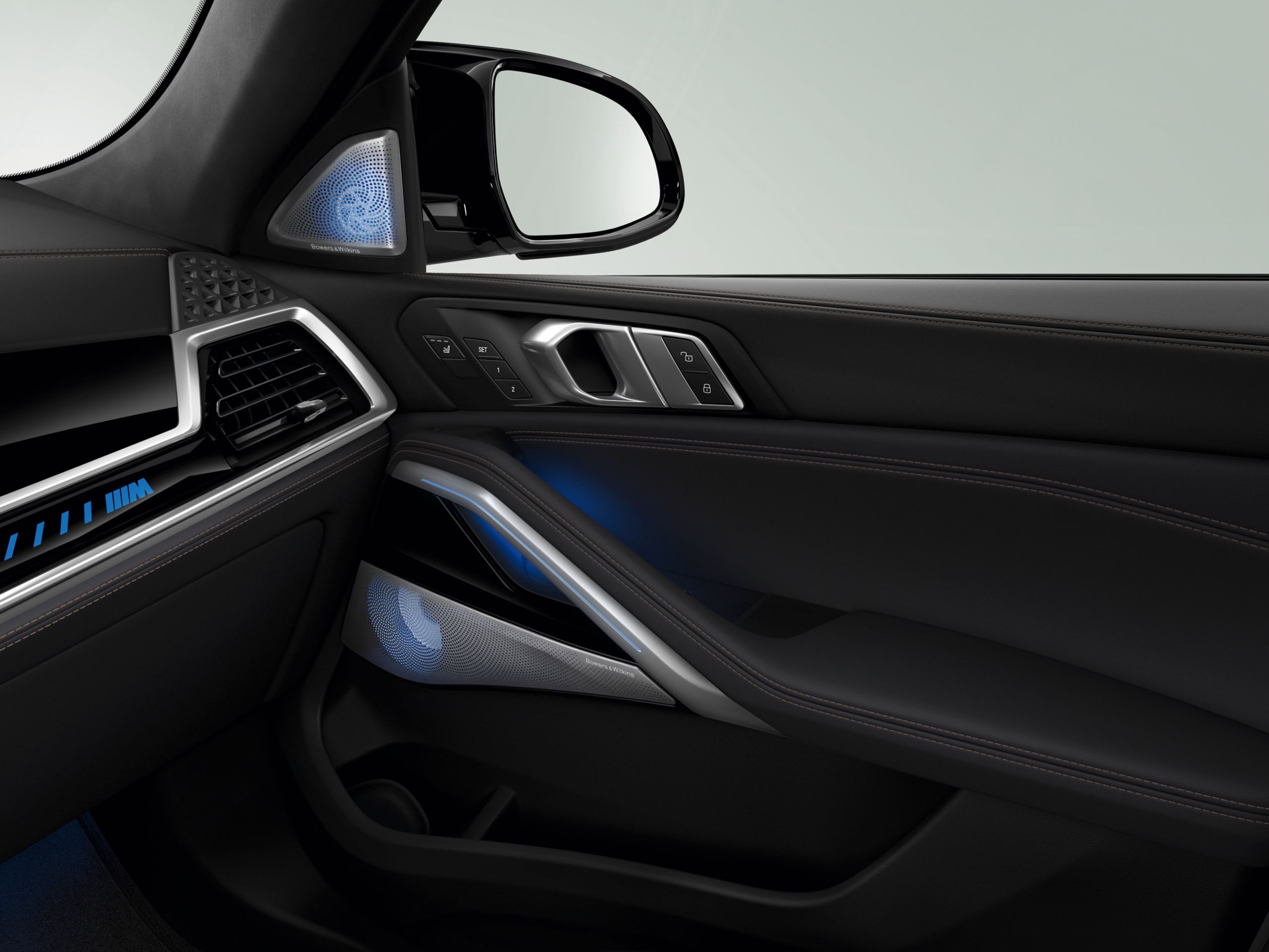 Speaker of the Bowers & Wilkins Diamond surround sound system BMW X6 with the door and dashboard visible