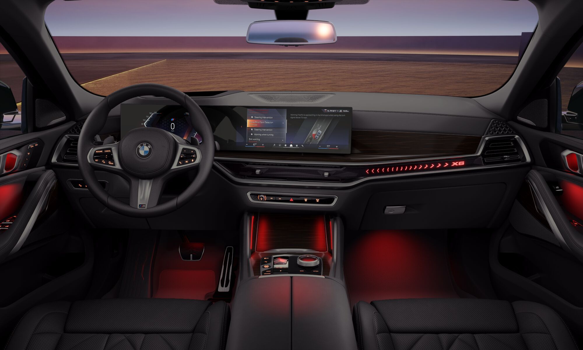 Cockpit view of the BMW X6 SUV with the M leather steering wheel in focus and the instrument cluster in the background