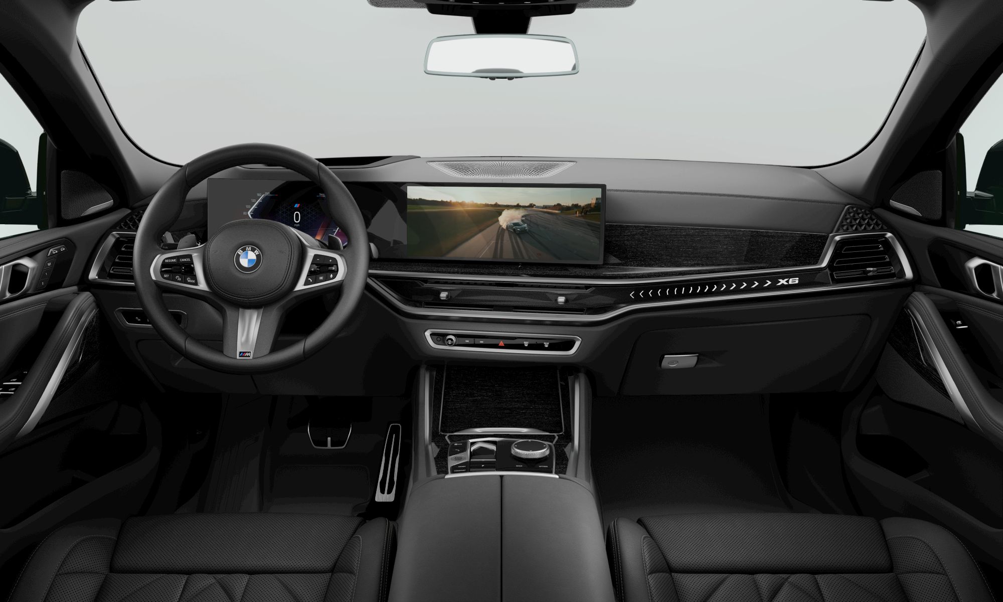Exterior and interior view of the BMW X6 with a video being played on the curved display 