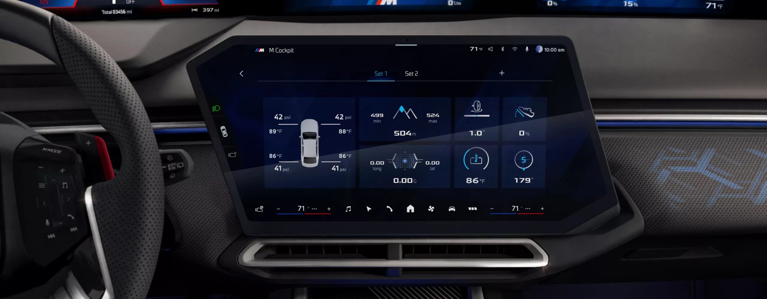 The central display in the BMW cockpit shows a screen with BMW M Apps.