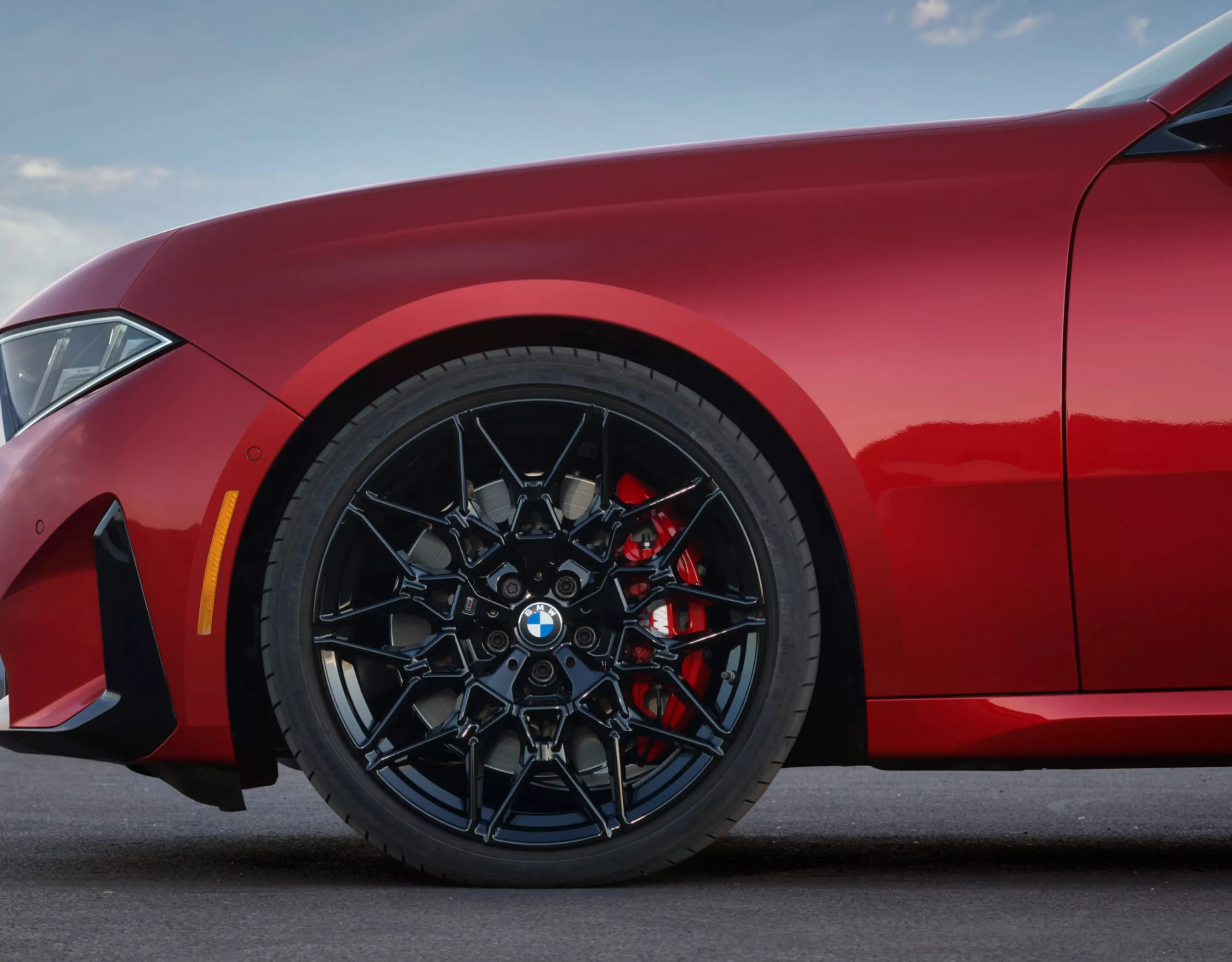 Front wheel with focus on the M Sport brake with red caliper.
