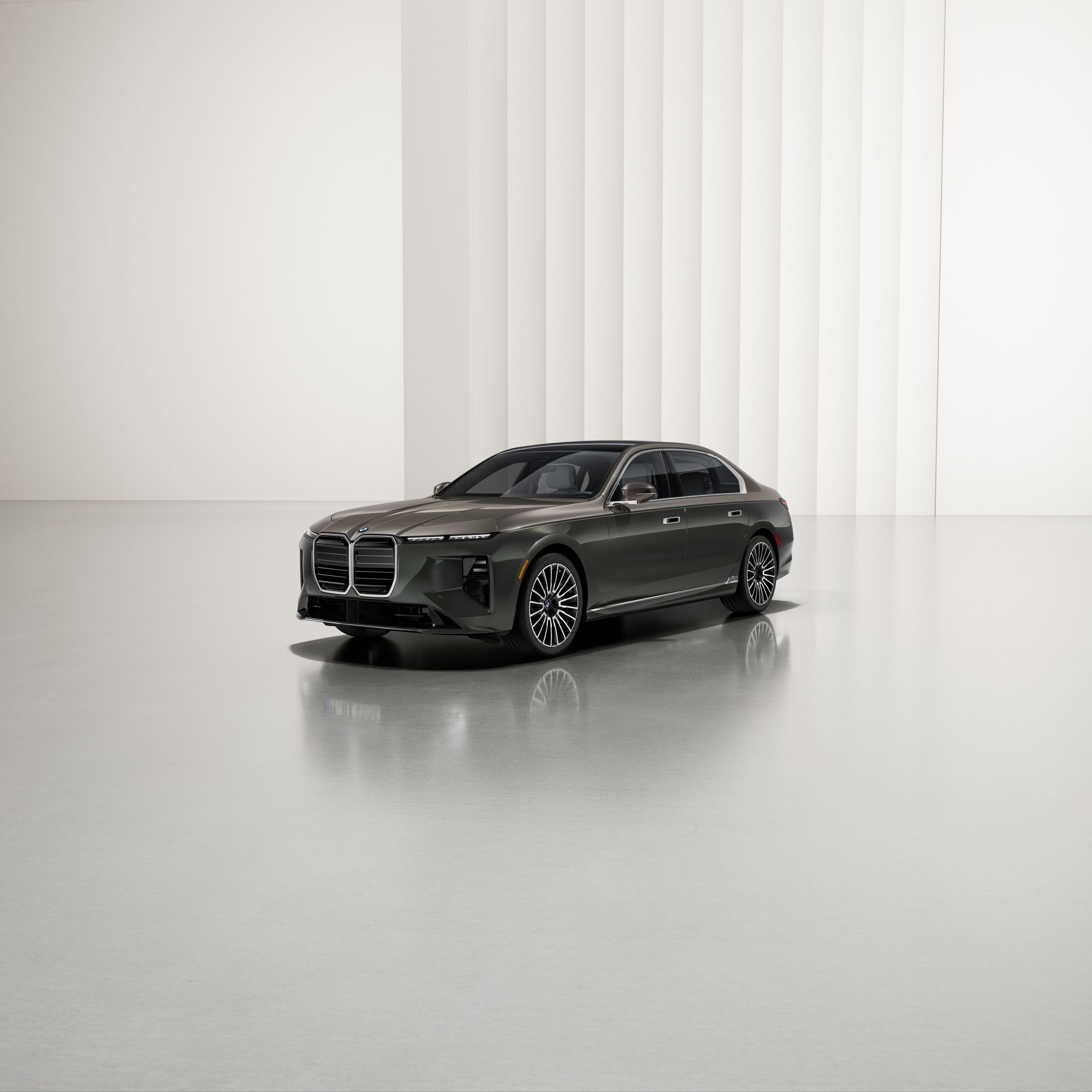 Vehicle is stationary at an angle on reflective ground with a modern background and features two-tone paintwork.