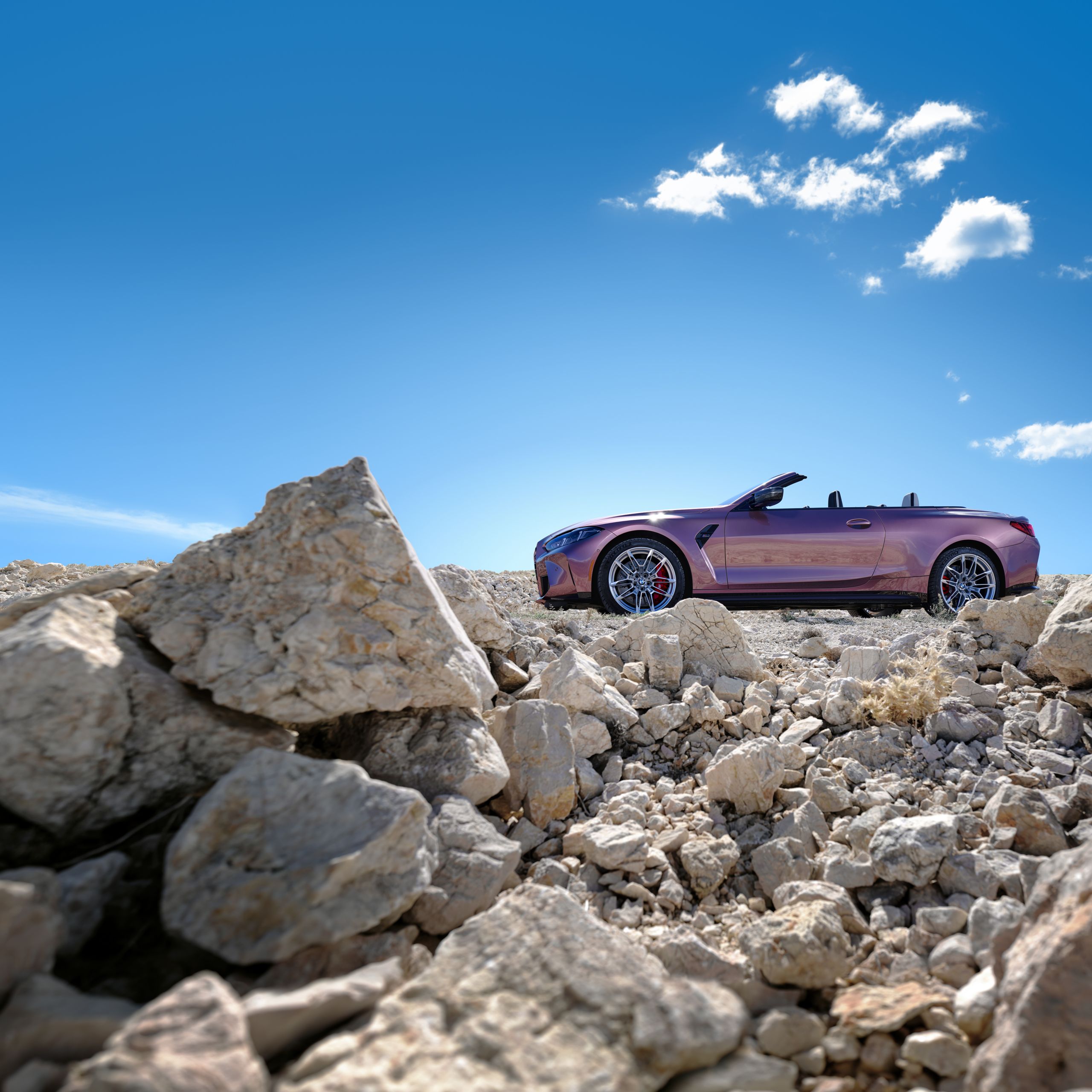 Exterior of the BMW M4 Competition M xDrive Convertible in BMW Individual Velvet Orchid paint finish