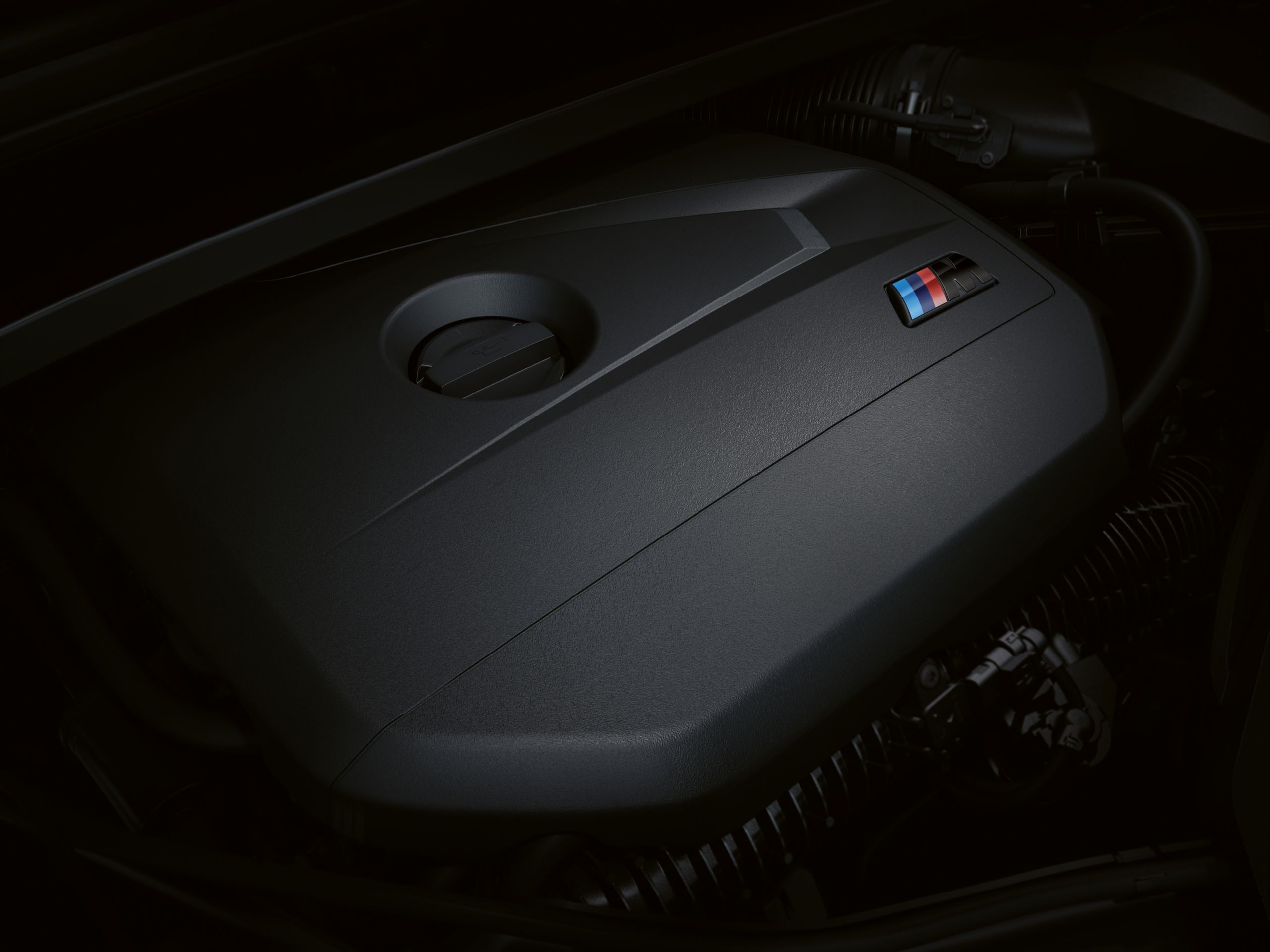 Close up of the BMW X1 M35i's M TwinPower Turbo inline 4-cylinder engine.