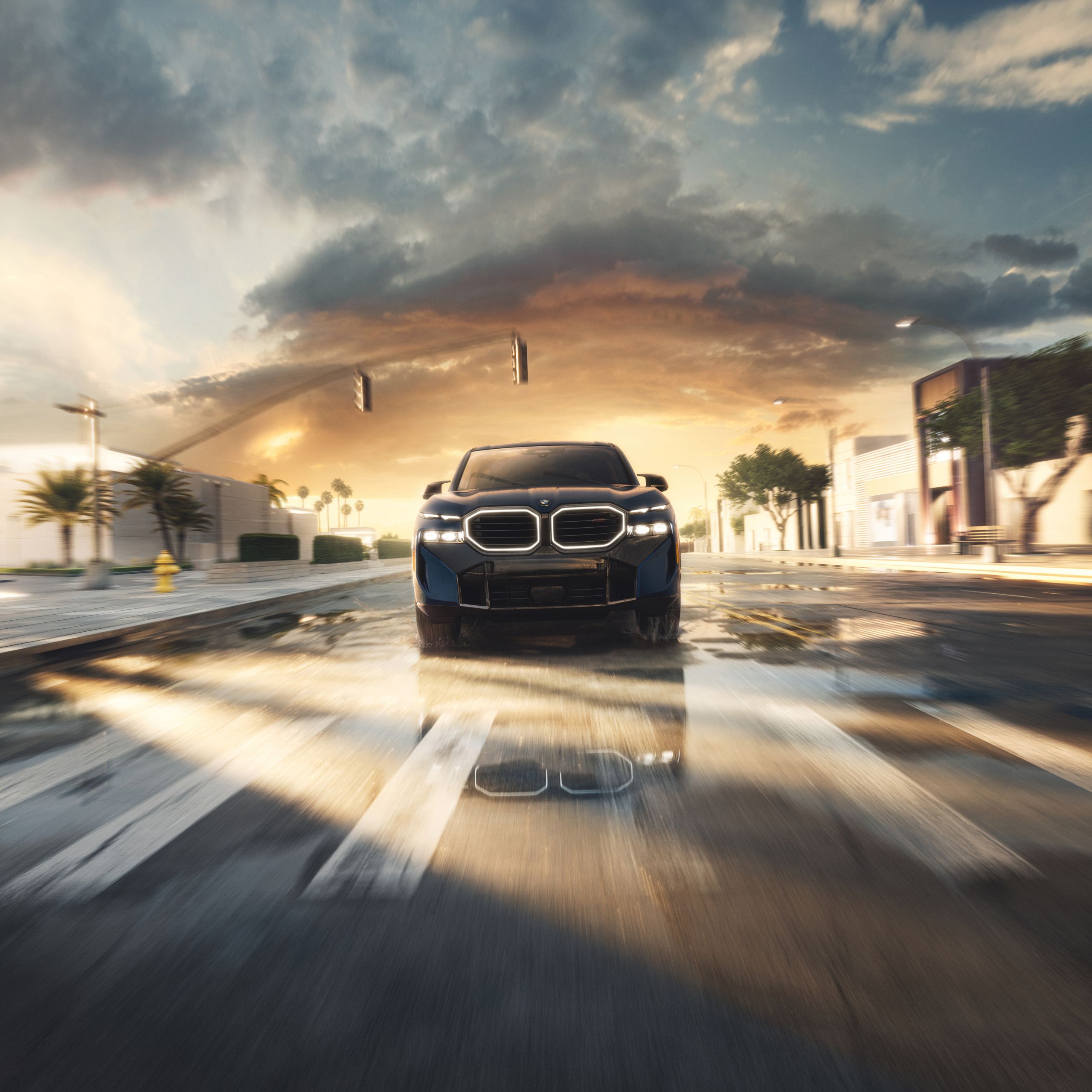 The BMW XM Label posed on a tropical by-way on top of slick pavement with the headlights on, giving the impression that it gazes down upon the viewer 
