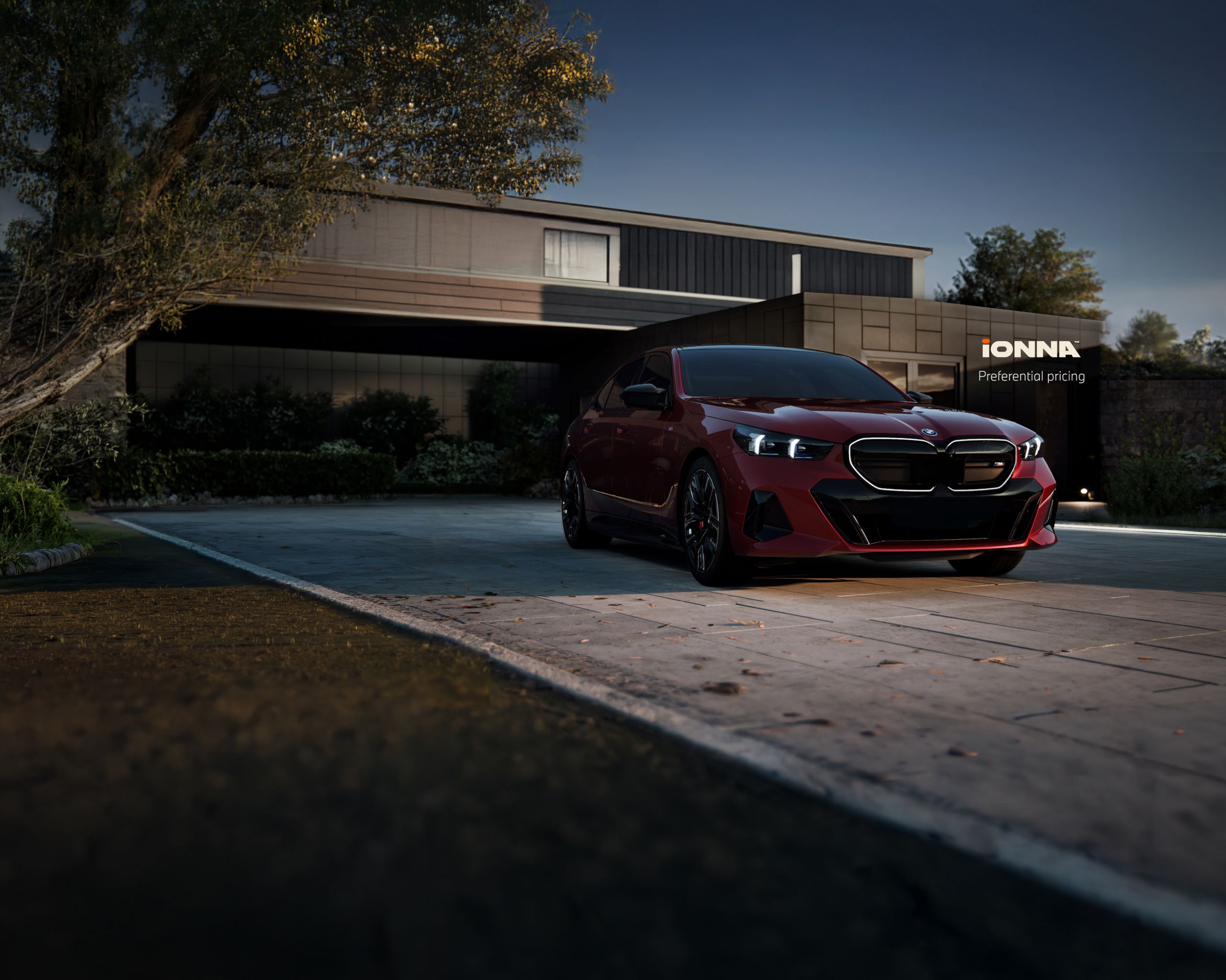 Heroic view of the BMW i5 M60 Sedan with glowing kidney grille parked in front of a modern building