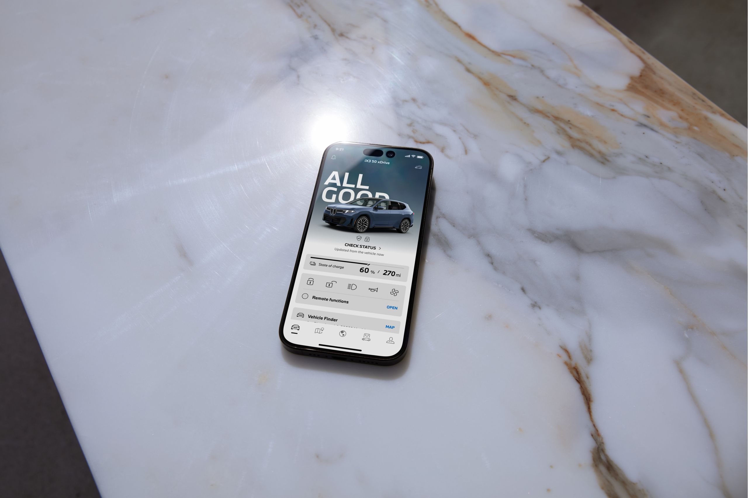 Smartphone with My BMW App lying on marble surface