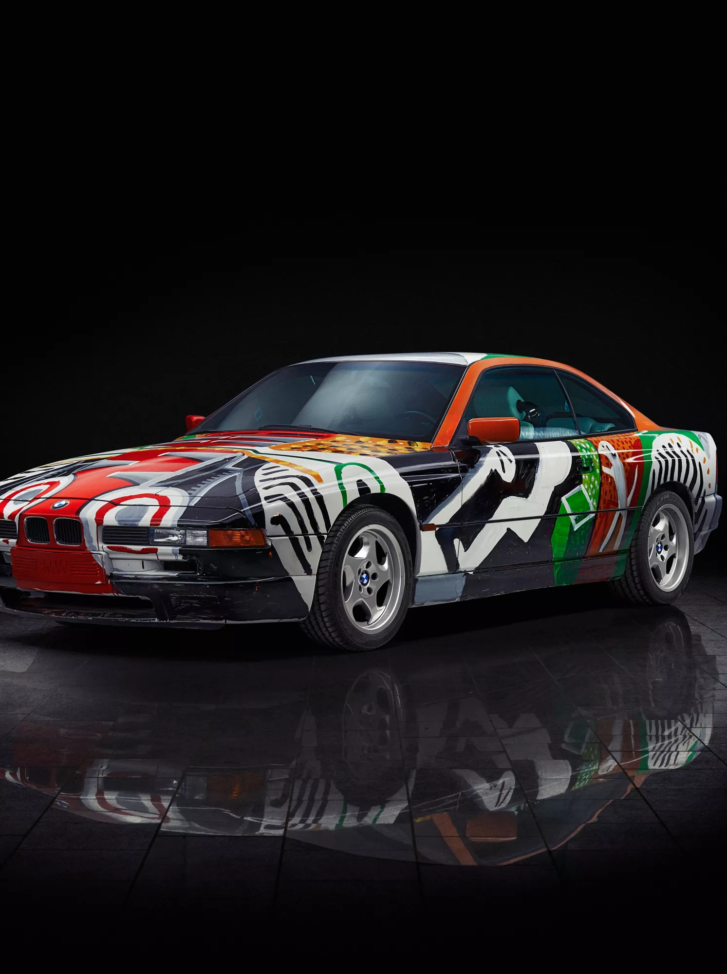 BMW 850 CSi Art Car by artist David Hockney, with a painted interior view revealing engine and technical elements.