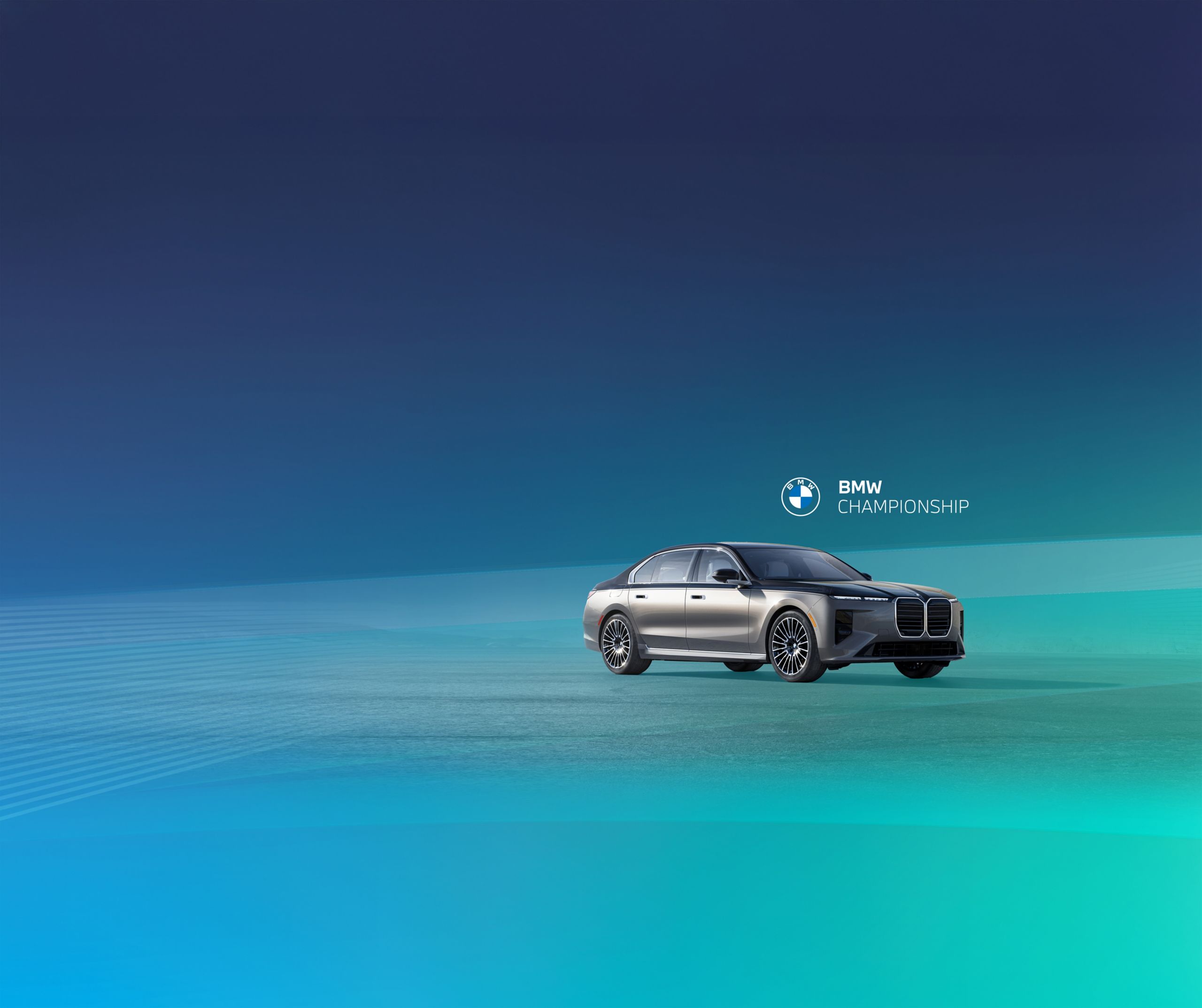 The BMW 7 Series sits parked in a bluish green studio space