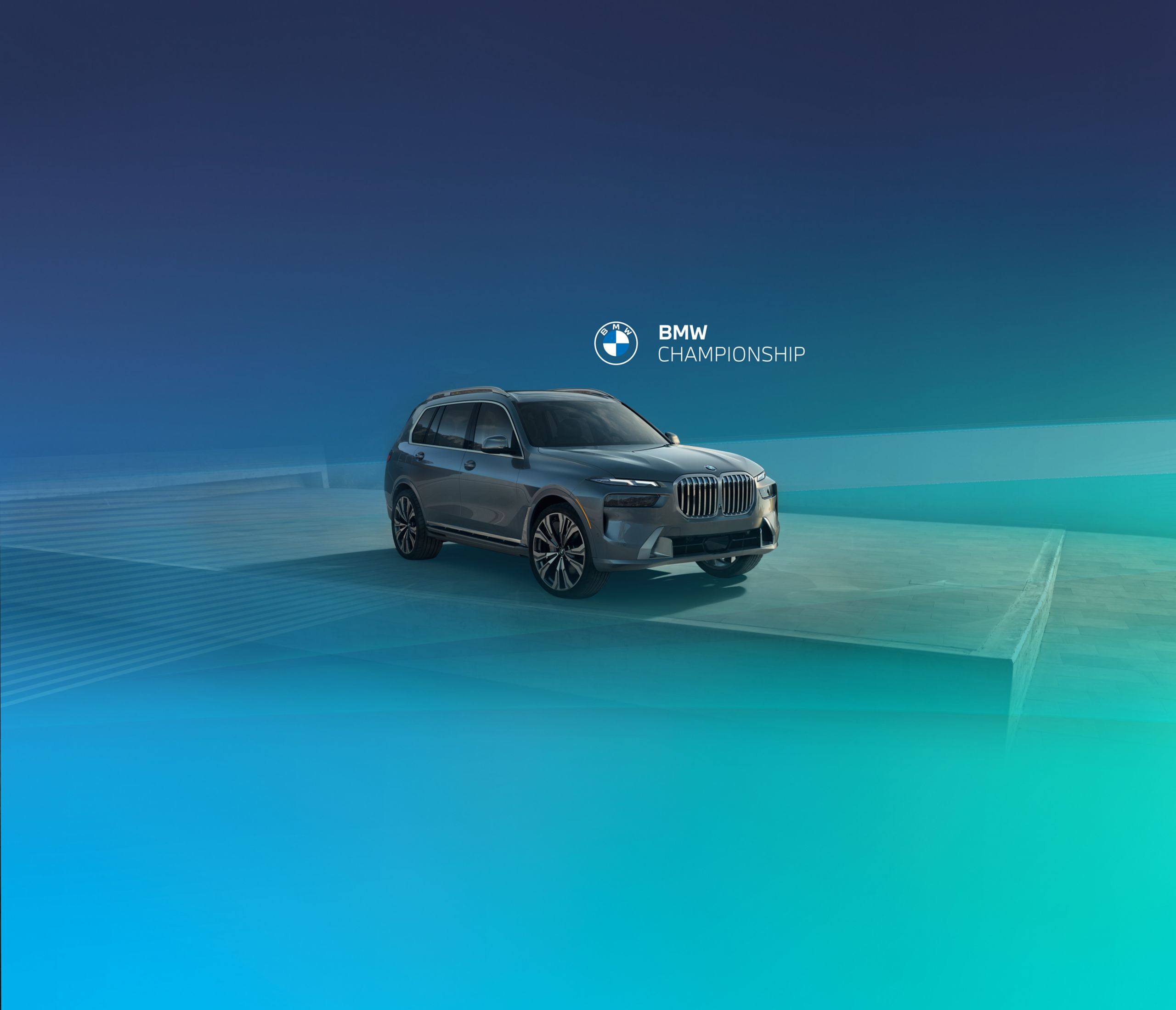 The BMW X7 sits parked in a bluish green studio space