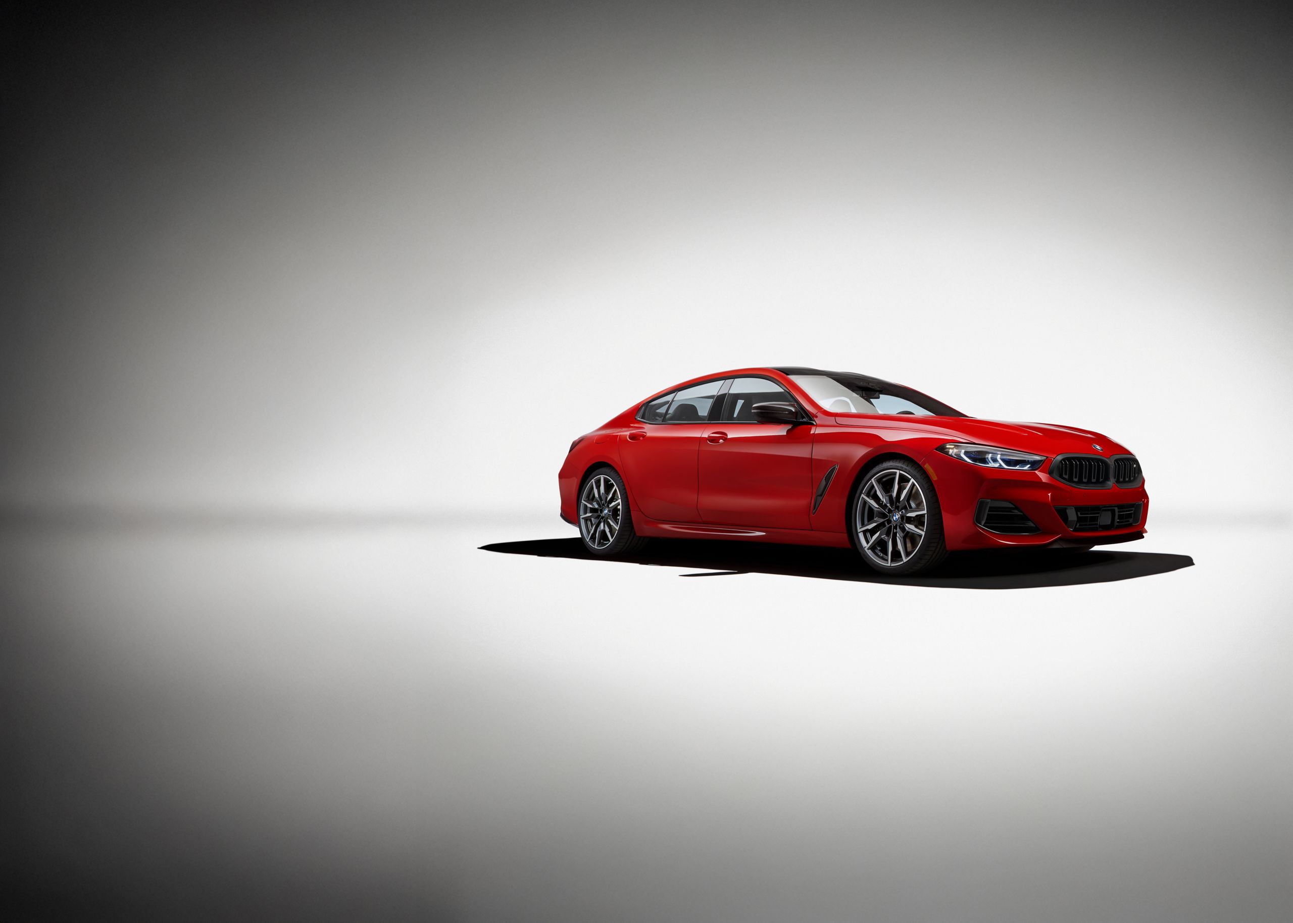 The M850i Edition M Heritage lit dramatically with a prominent shadow