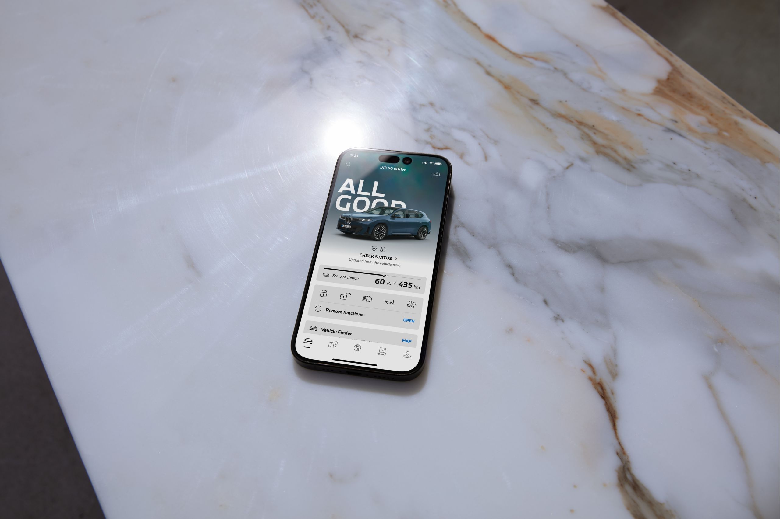Smartphone with My BMW App lying on marble surface