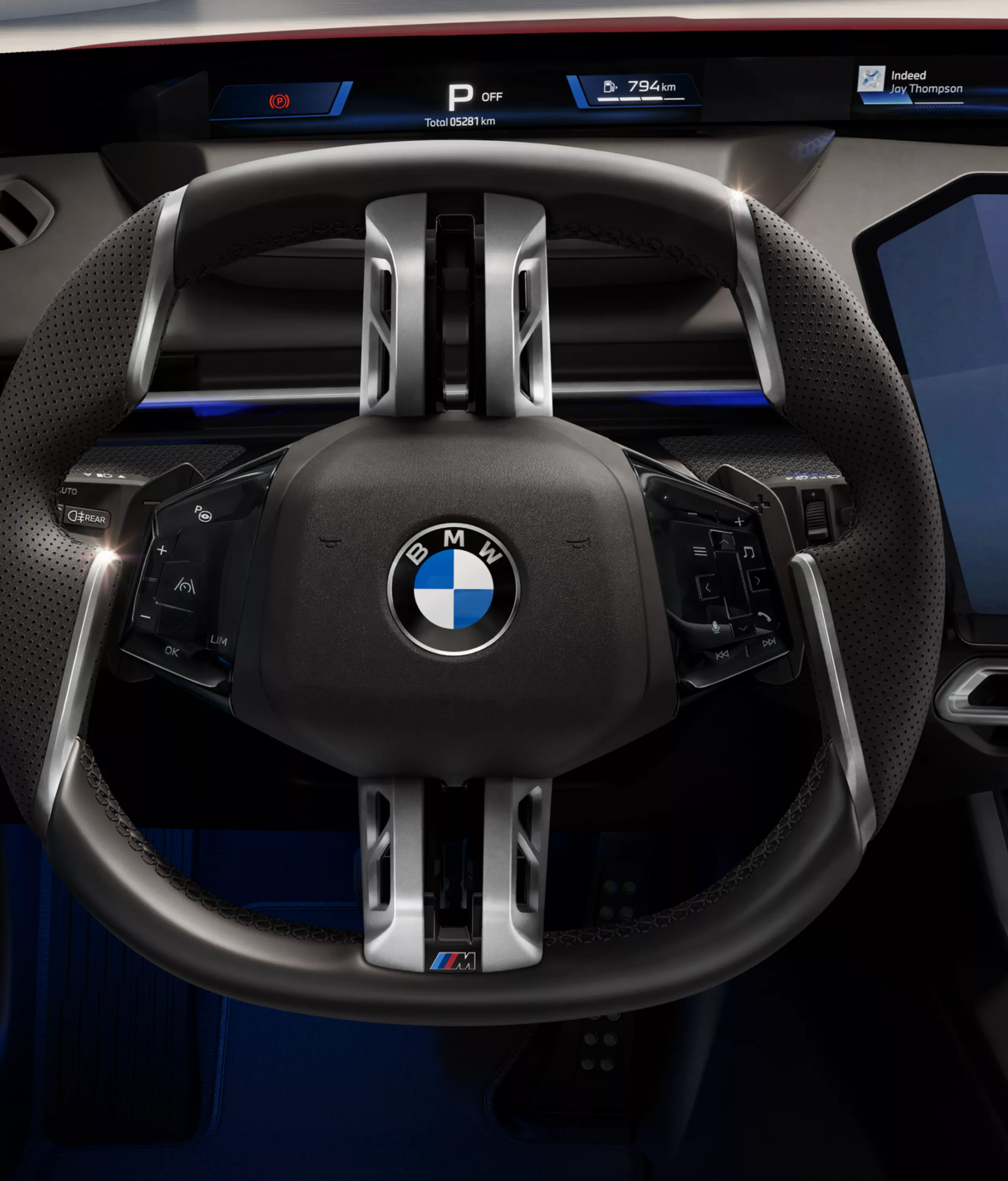 Cockpit from the driver's perspective, with the sports steering wheel in the center.