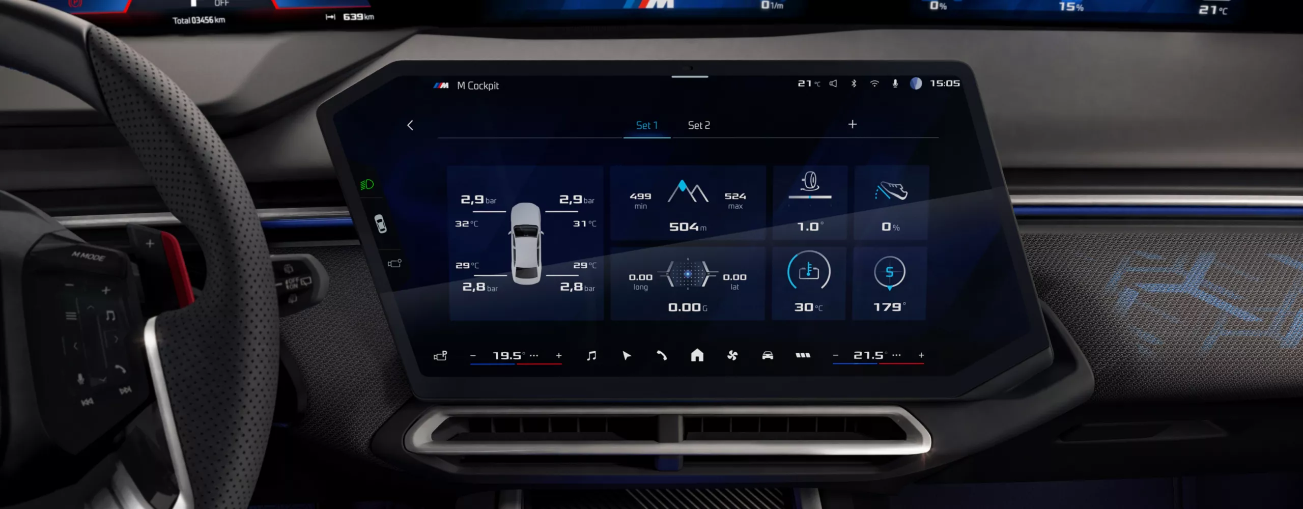 The central display in the BMW cockpit shows a screen with BMW M Apps.