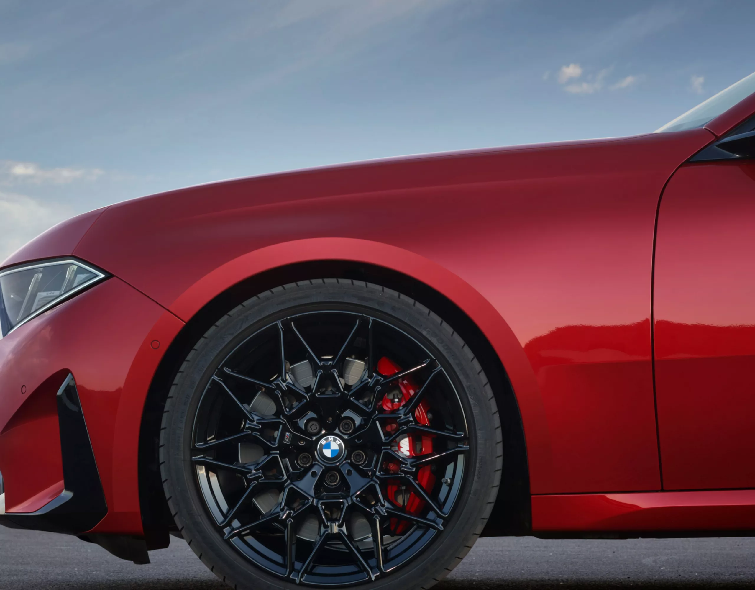 Front wheel with focus on the M Sport brake with red caliper.