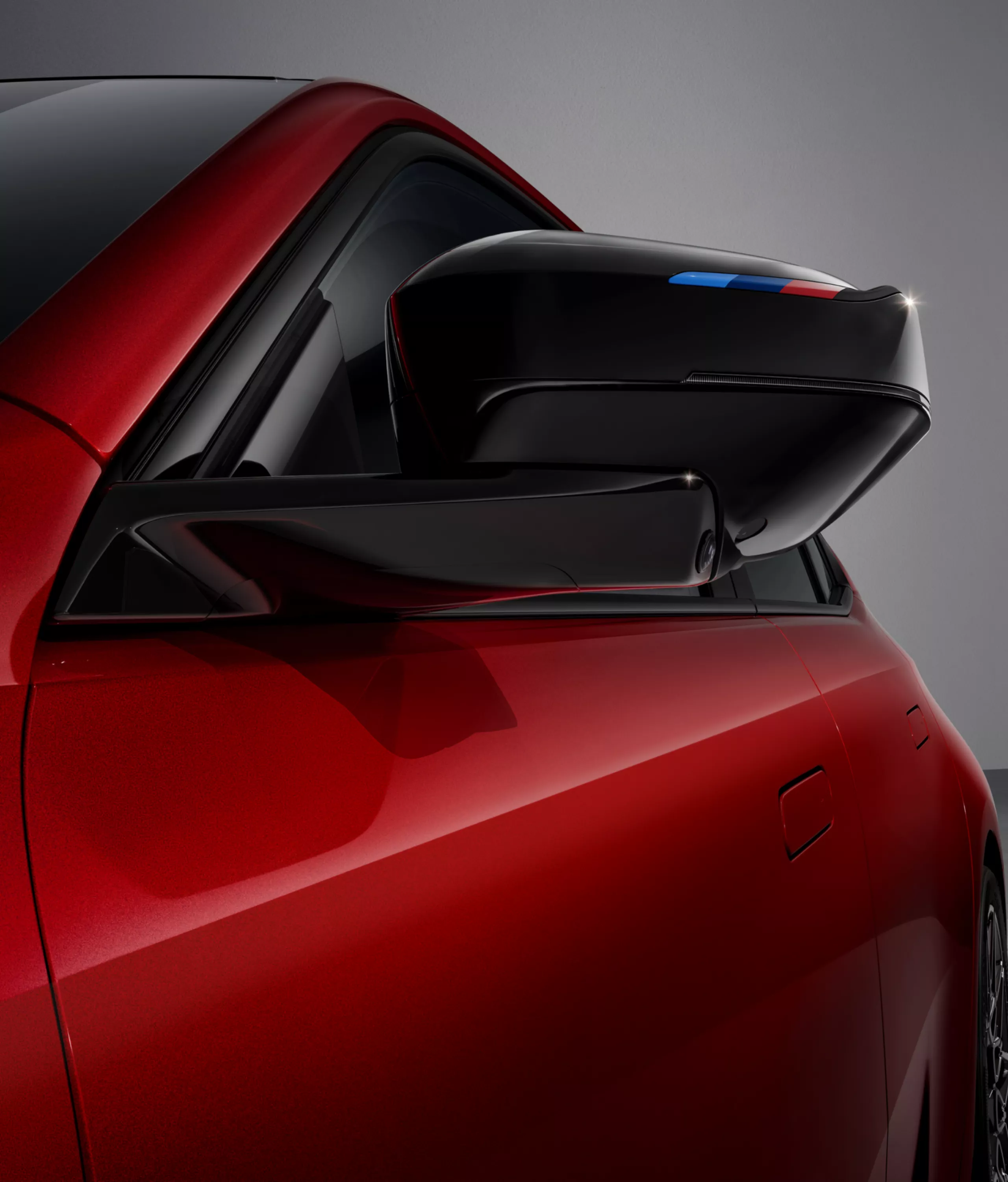 Detailed view of the driver's M exterior mirror.