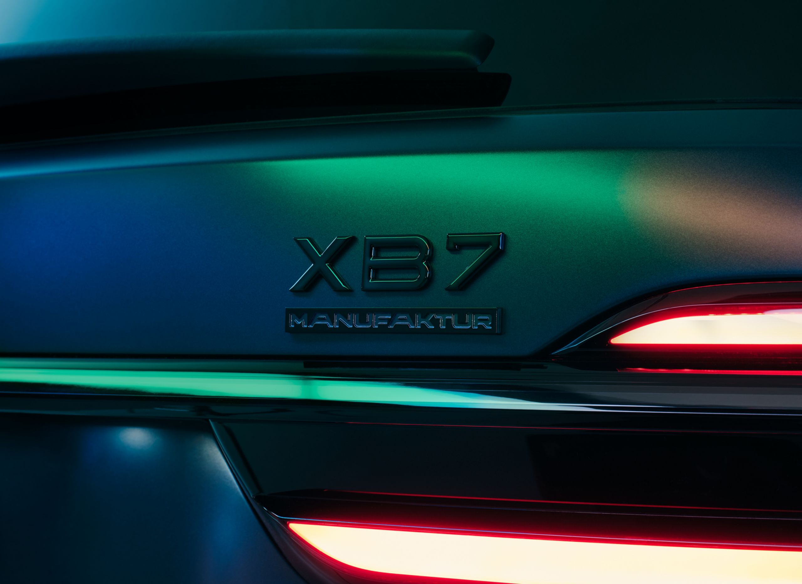 A close up of the XB7 MANUFAKTUR emblem on the rear of the vehicle.
