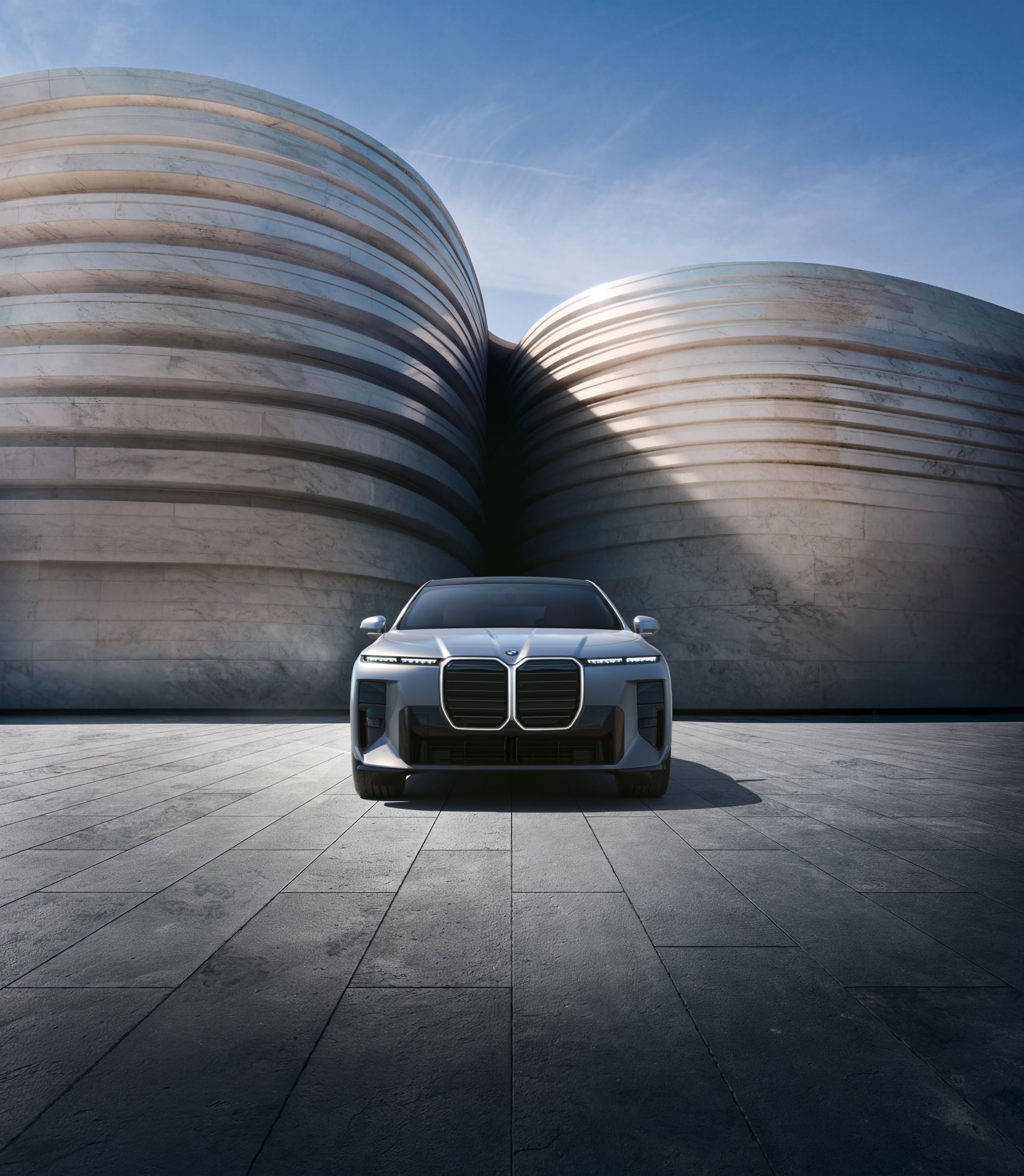 Exterior view of the front of the vehicle with a modern building in the background.