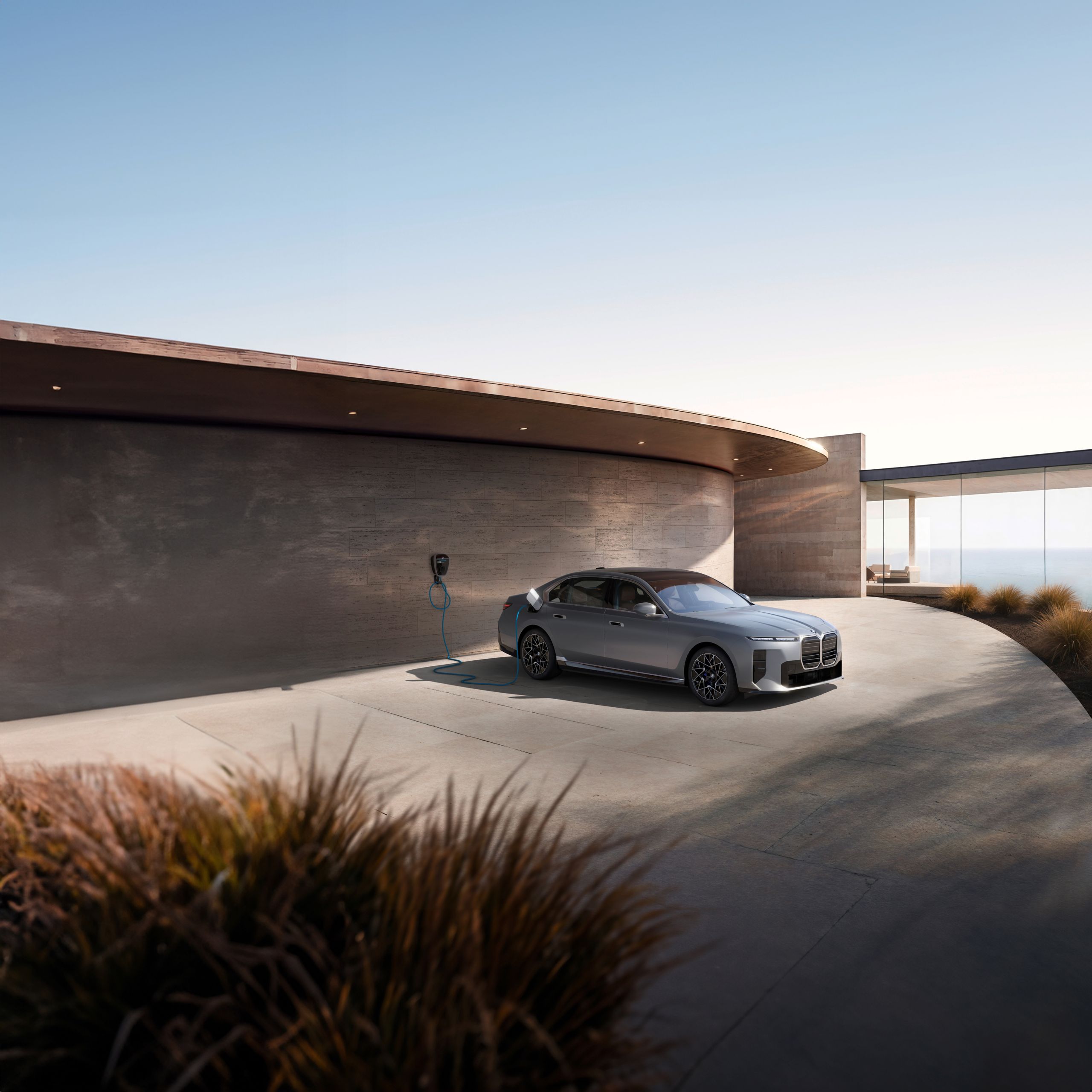 Dramatic showroom view of the 2027 BMW i7 Sedan with a reflecting image on a polished white floor