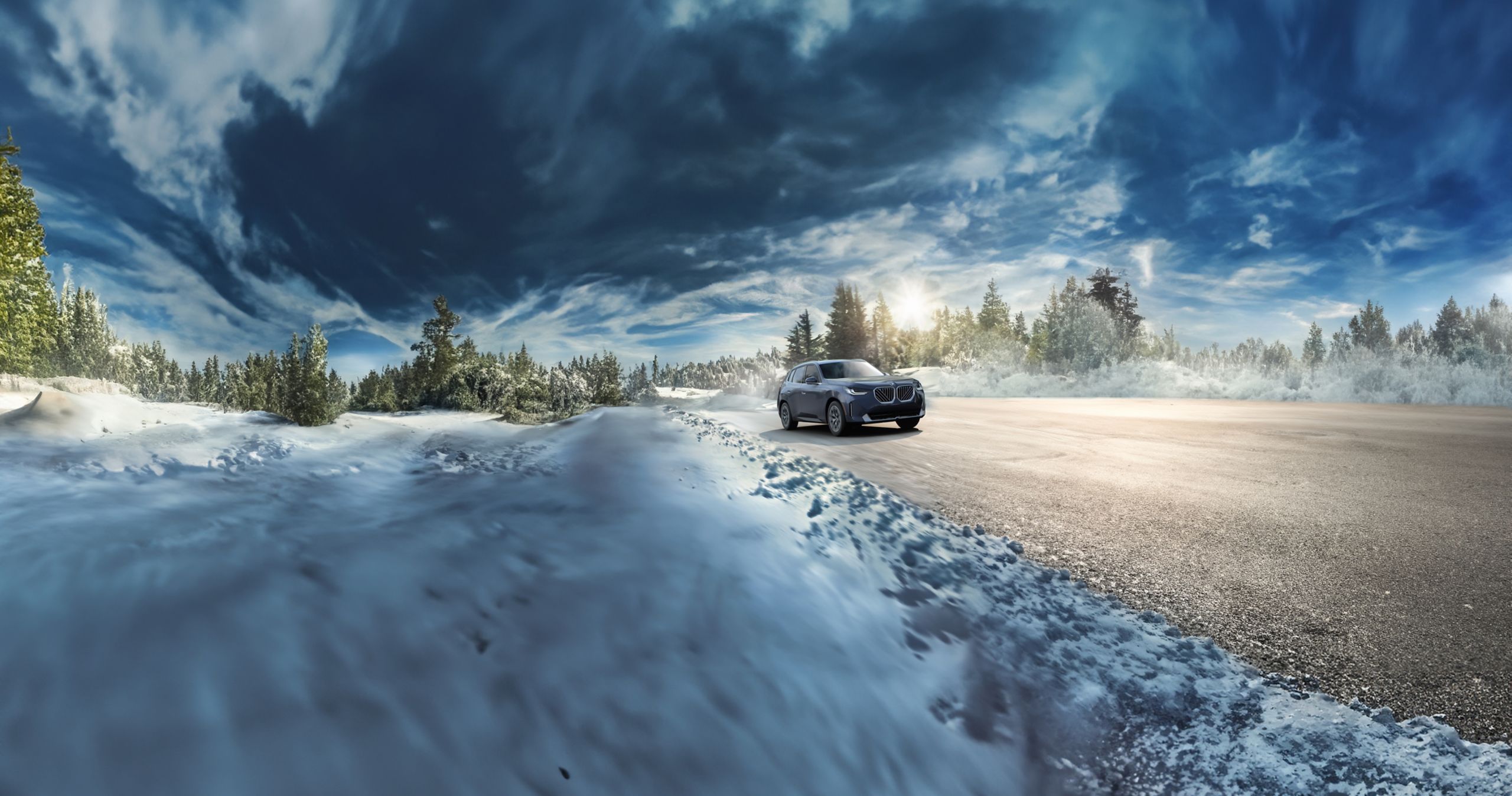The BMW X3 30 xDrive driving through a winter landscape.