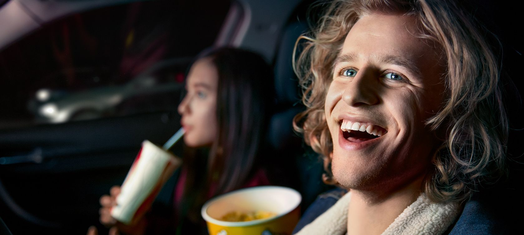 BMW happy customers: young woman and man.