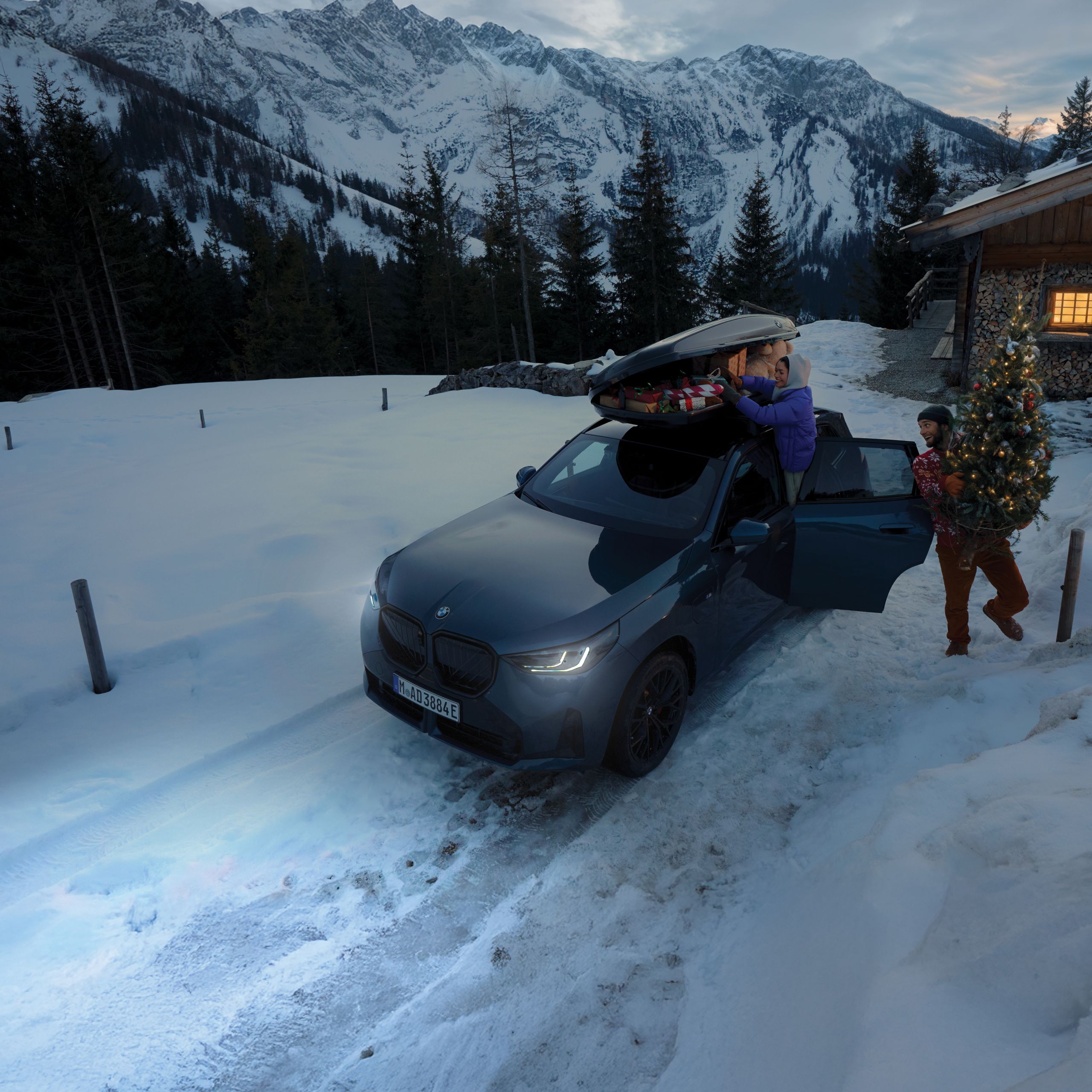 BMW Lifestyle BMW M Motorsport Collection featuring a hoodie, shorts, and t-shirt, worn by two young persons